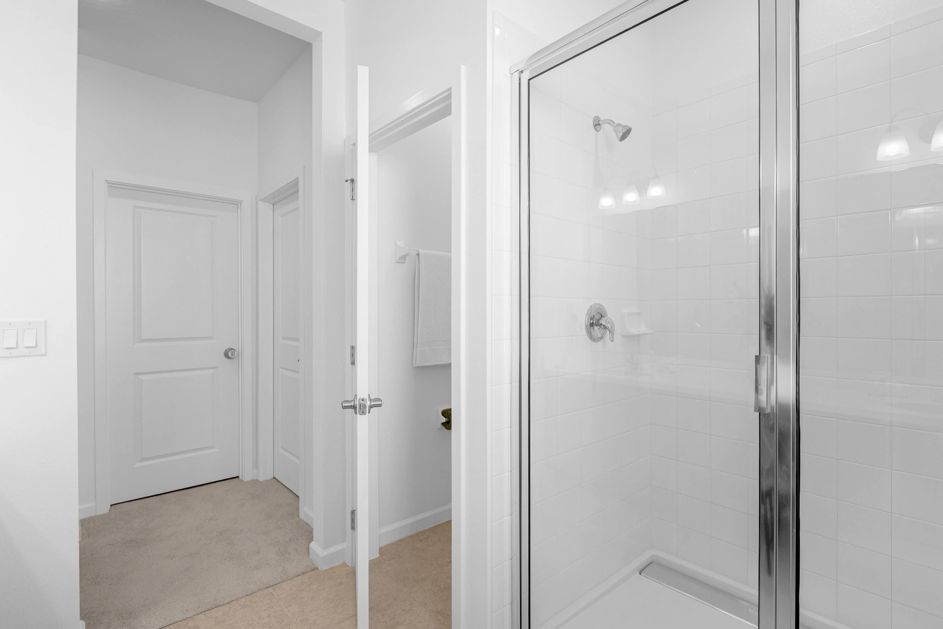 Sleek Shower Room Featuring Bright Interiors And Modern Fixtures