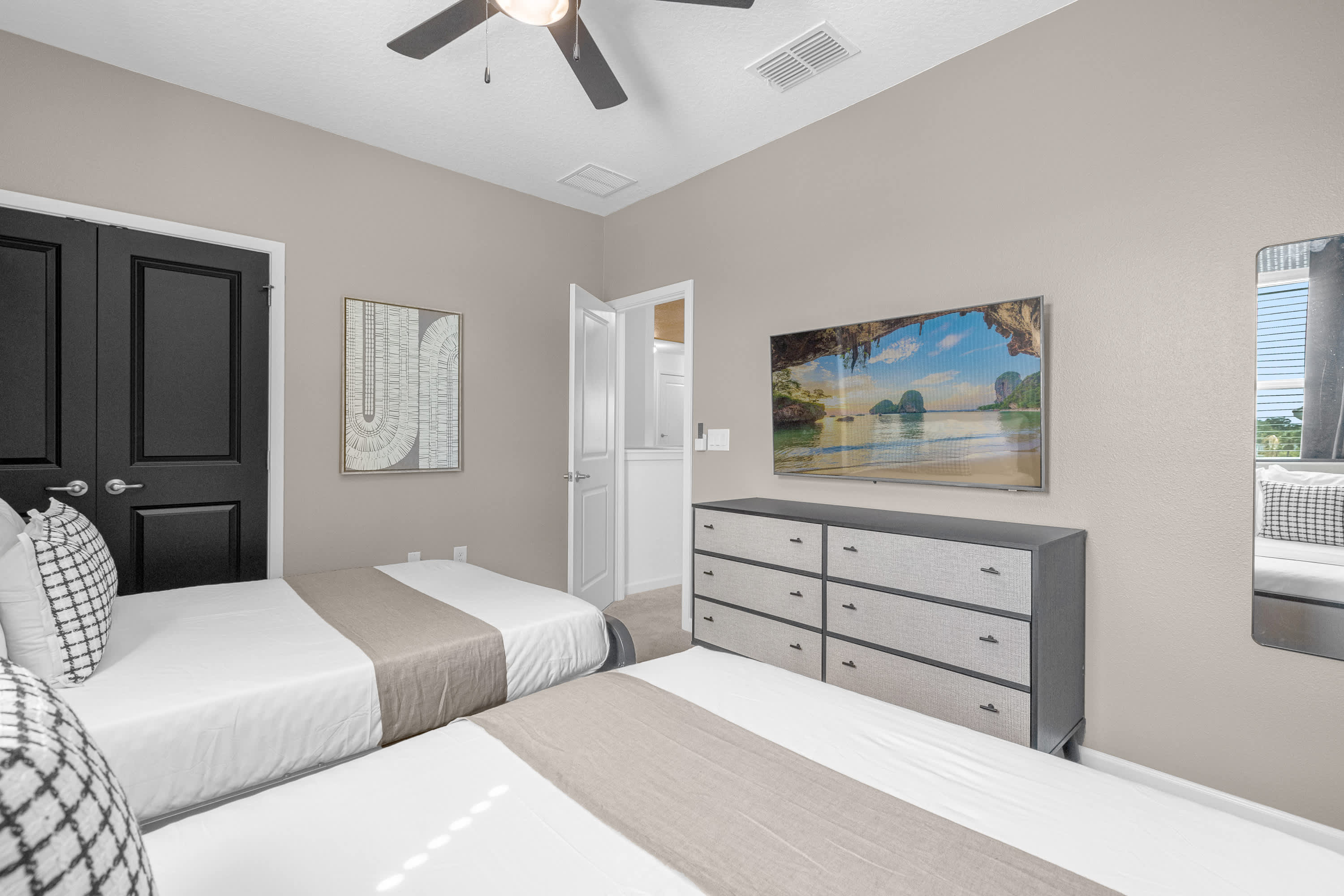 Inviting Bedroom With Scenic Artwork And A Serene Atmosphere