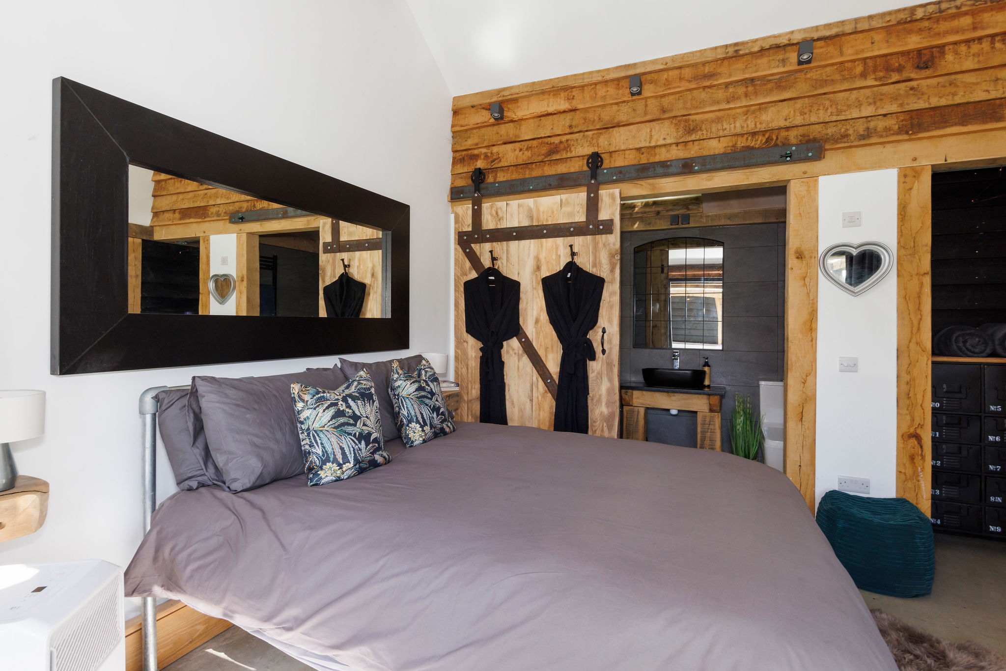 The double bedroom has comfy quality linen and cushions for a good nights rest.