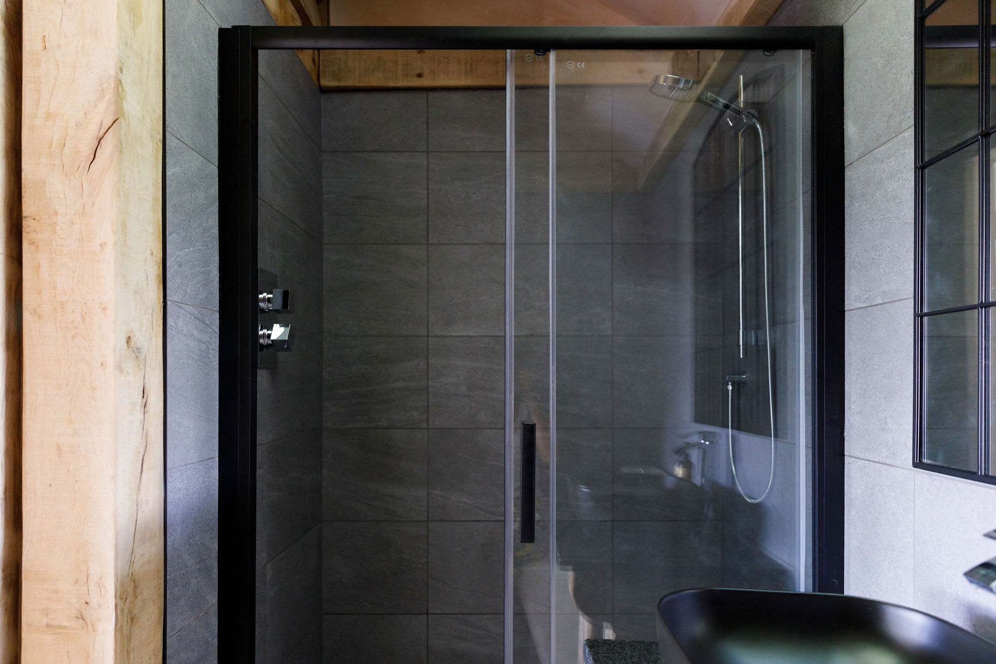 The surprisingly spacious ensuite bathroom features a huge walk-in shower.