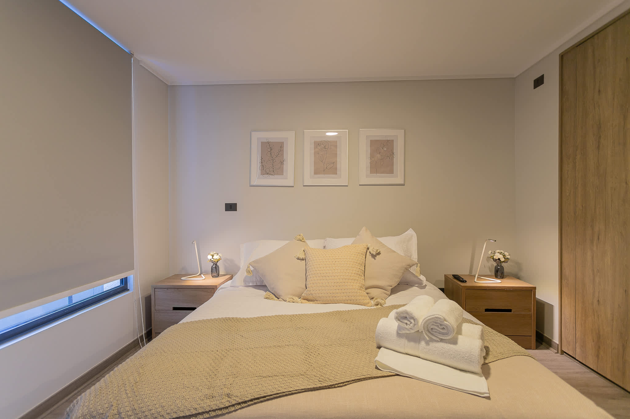 Relax in this cozy studio bedroom with soft lighting and elegant decor, perfect for a restful stay in the heart of the city.