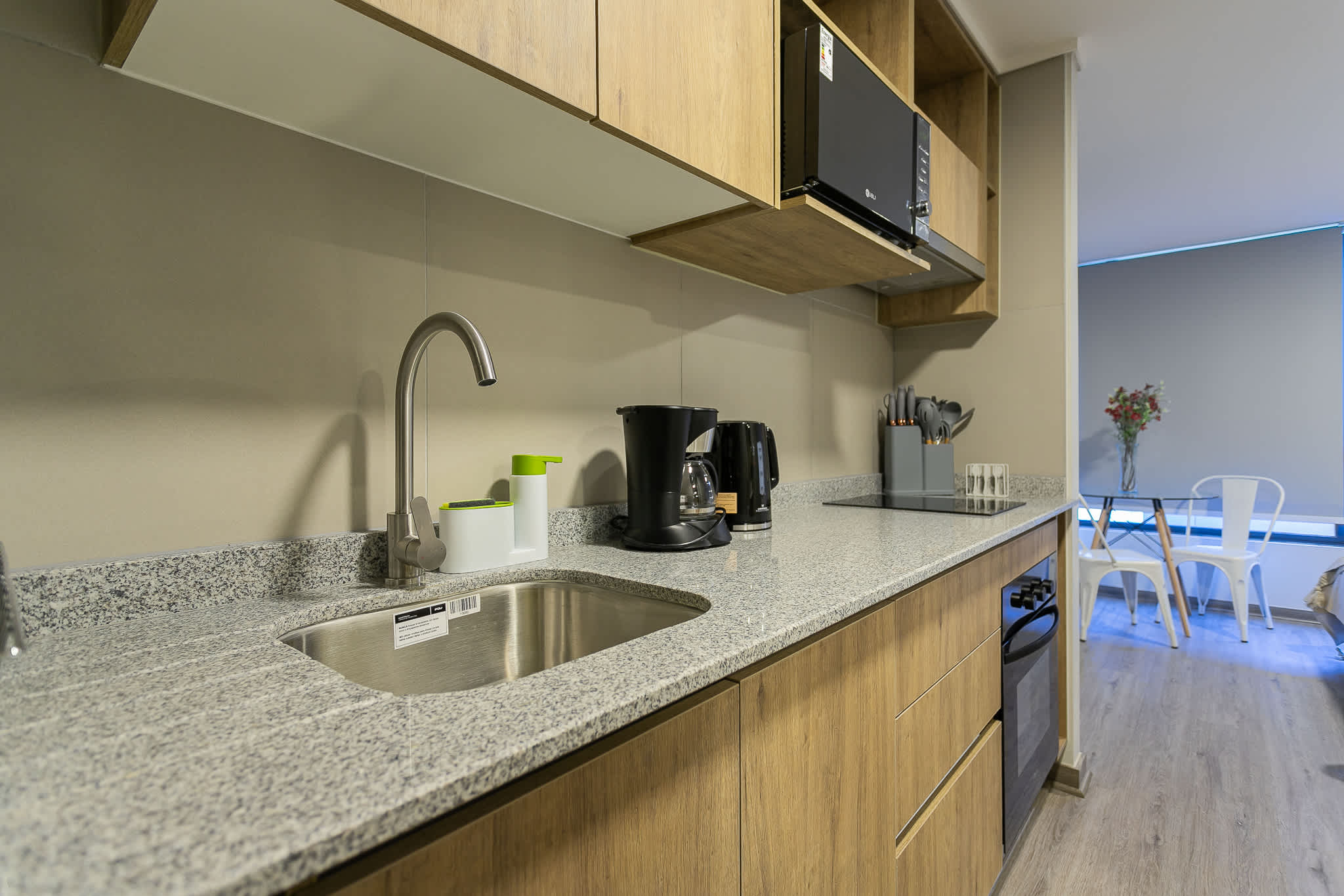 Experience culinary convenience in this sleek, modern kitchen with all essentials for a perfect stay.