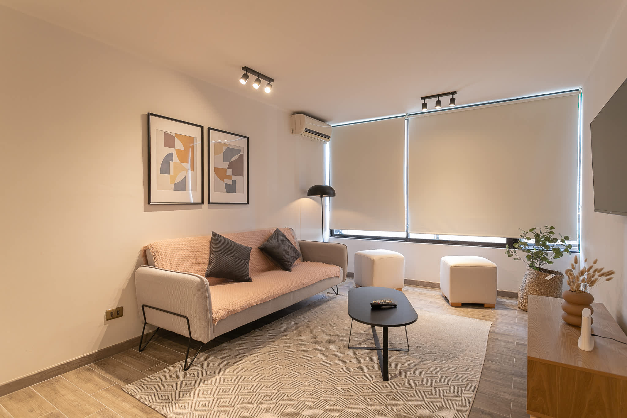 Unwind in a stylish living room with modern decor and cozy seating, perfect for relaxing after a day of adventure.