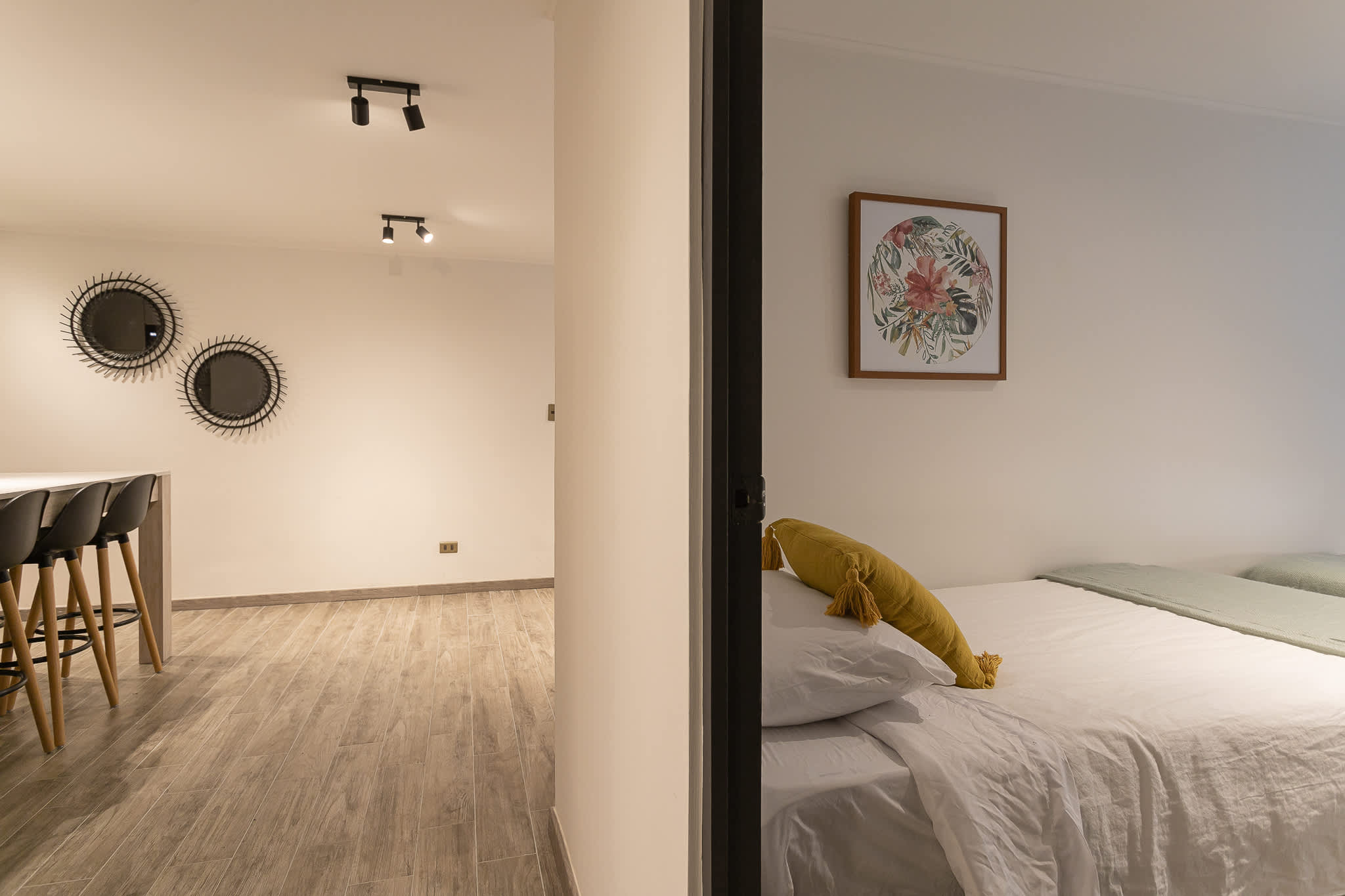 Inviting bedroom with modern dining area, perfect for relaxation and meals.