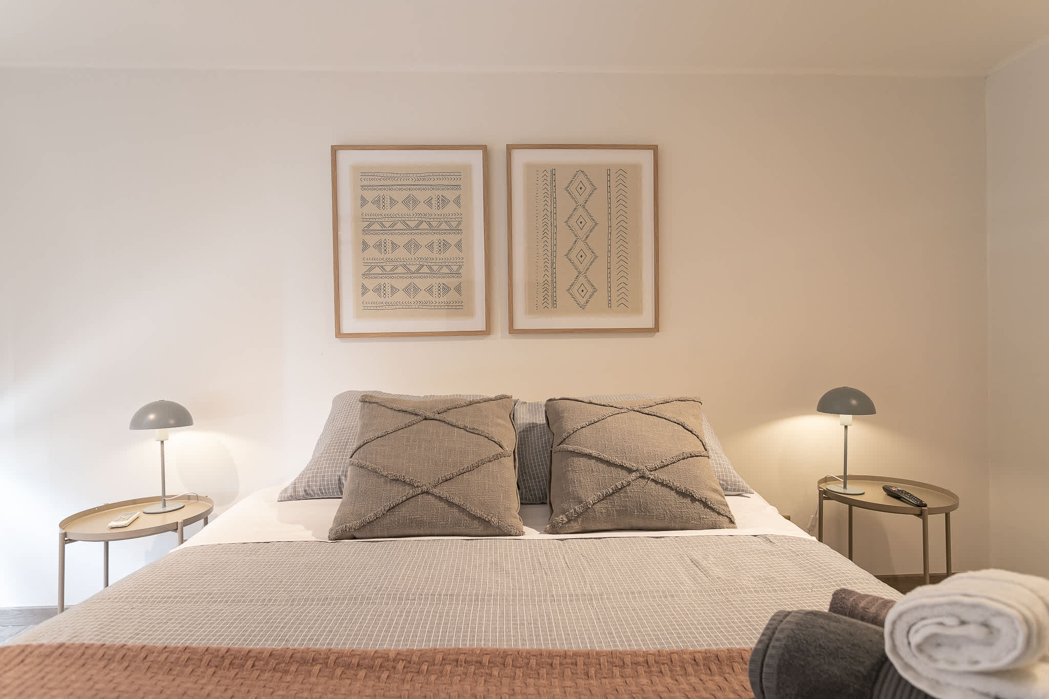Unwind in this elegant bedroom with soft lighting and chic decor, perfect for a peaceful retreat.