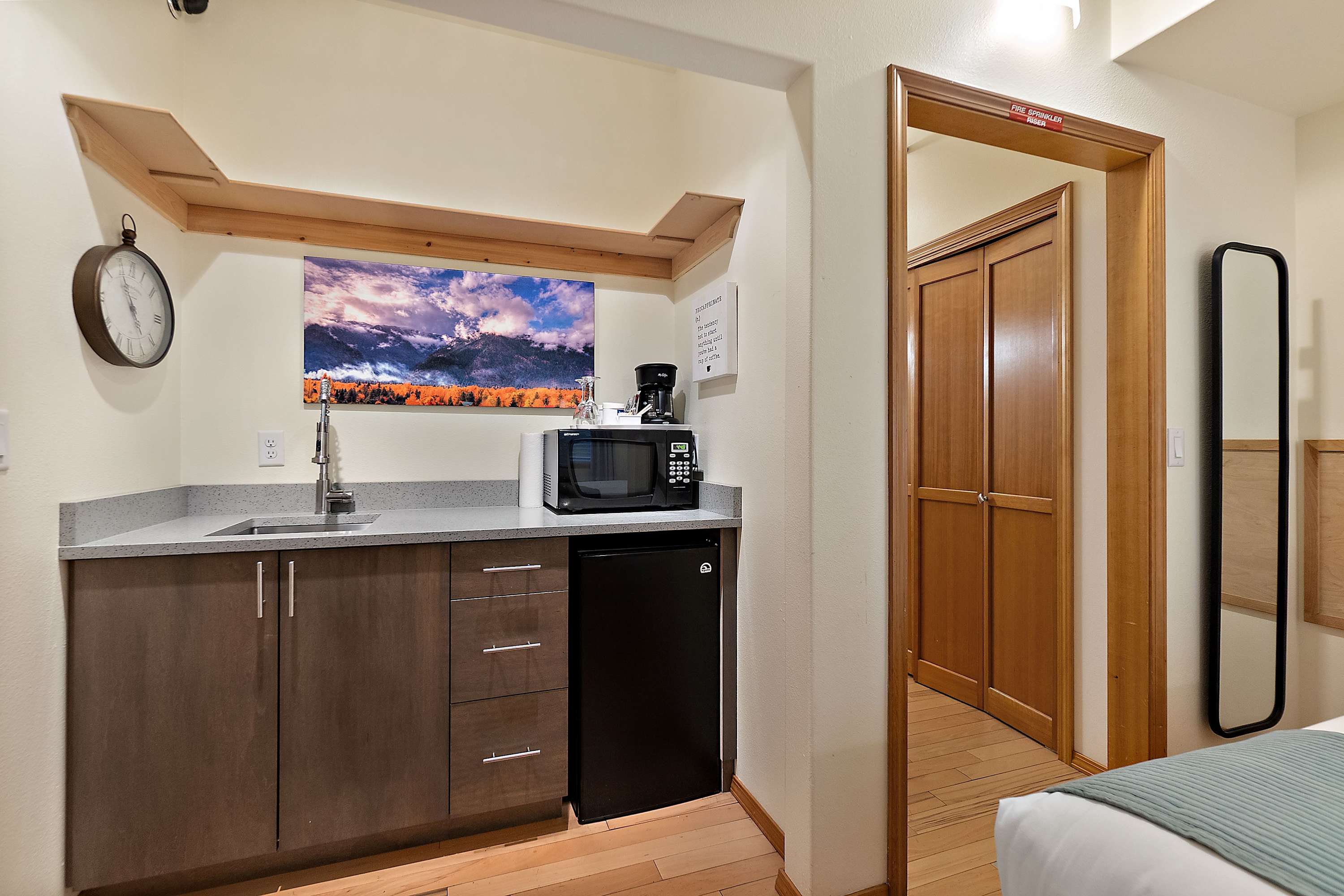 Kitchenette with coffee bar, sink, microwave, and mini fridge!