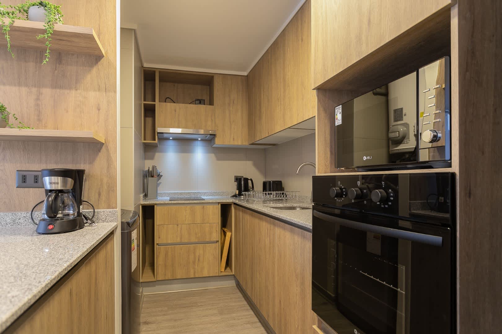 Modern kitchen with sleek appliances and ample counter space, perfect for cooking up your favorite meals.