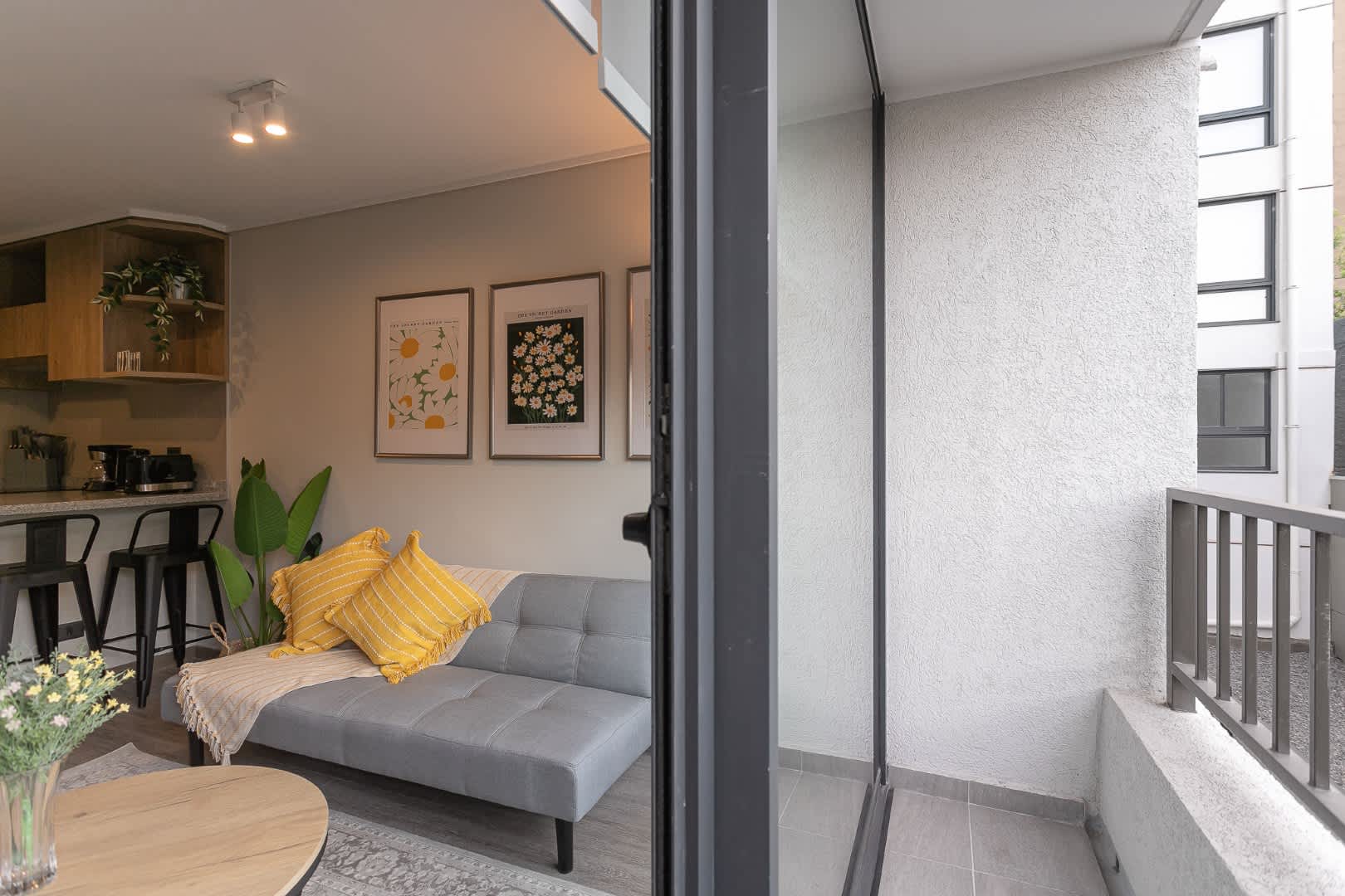 Charming studio with a cozy living area and a sunny balcony, perfect for relaxing after a day exploring the city.