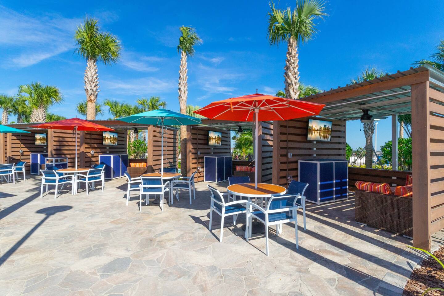 Shady poolside cabanas with food and drink service at the resort.