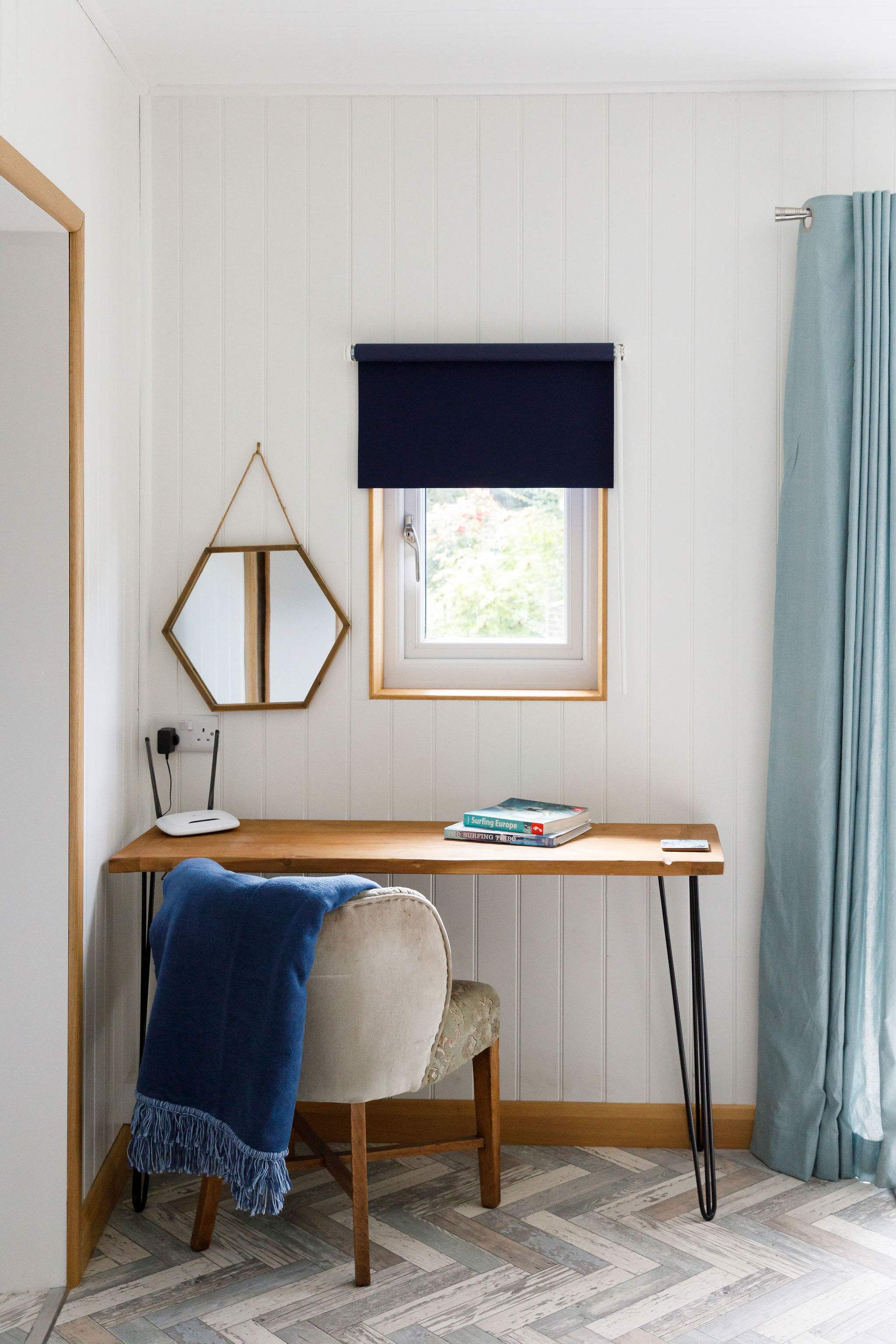 A desk and chair can be found in the living space, making catching up with work easy.