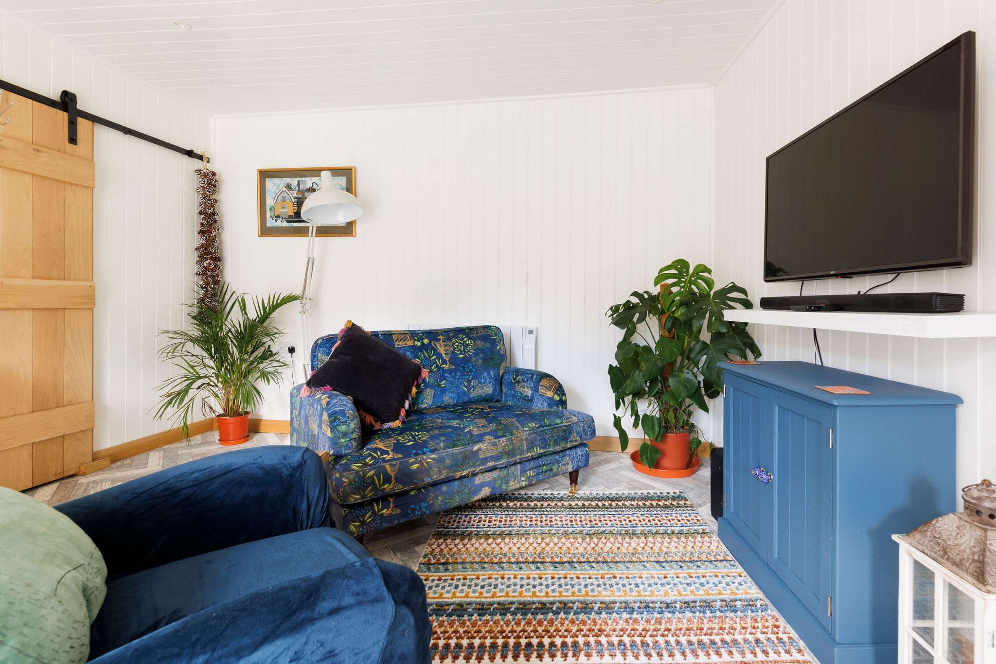 Enjoy a good book on the comfortable sofa with cushions.