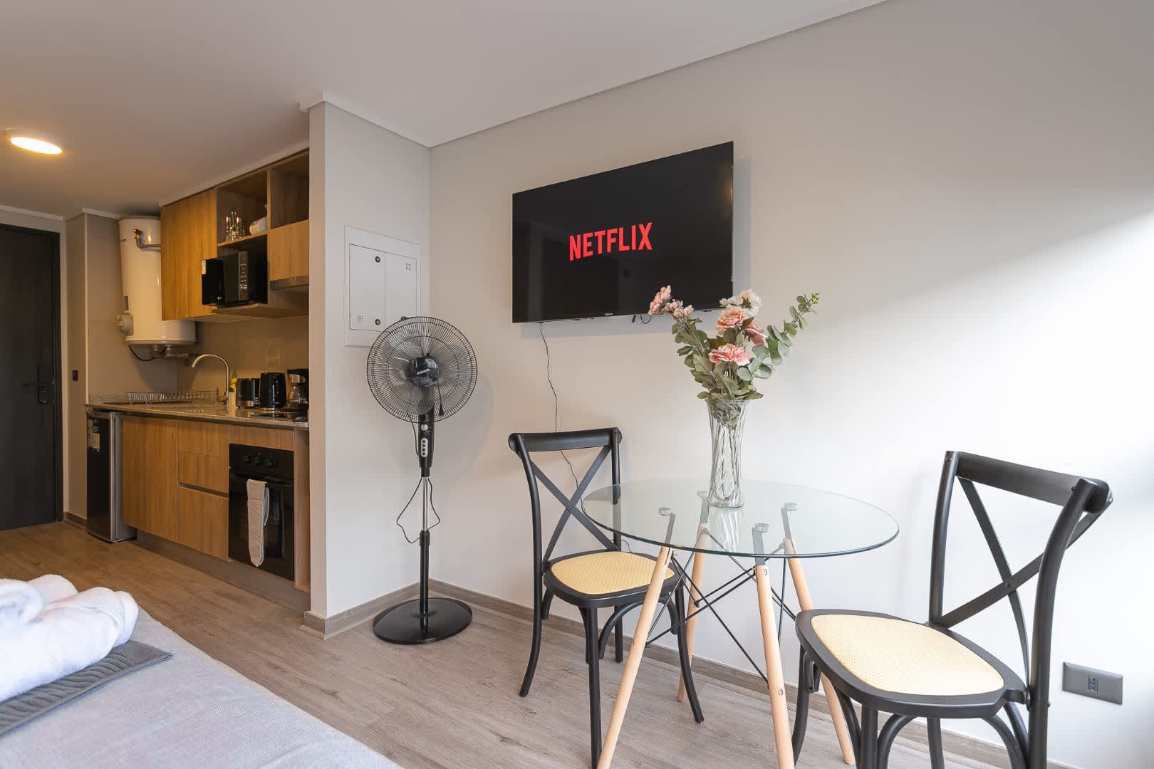 Cozy studio with modern amenities, including a kitchenette and Netflix-ready TV, perfect for a relaxing stay.