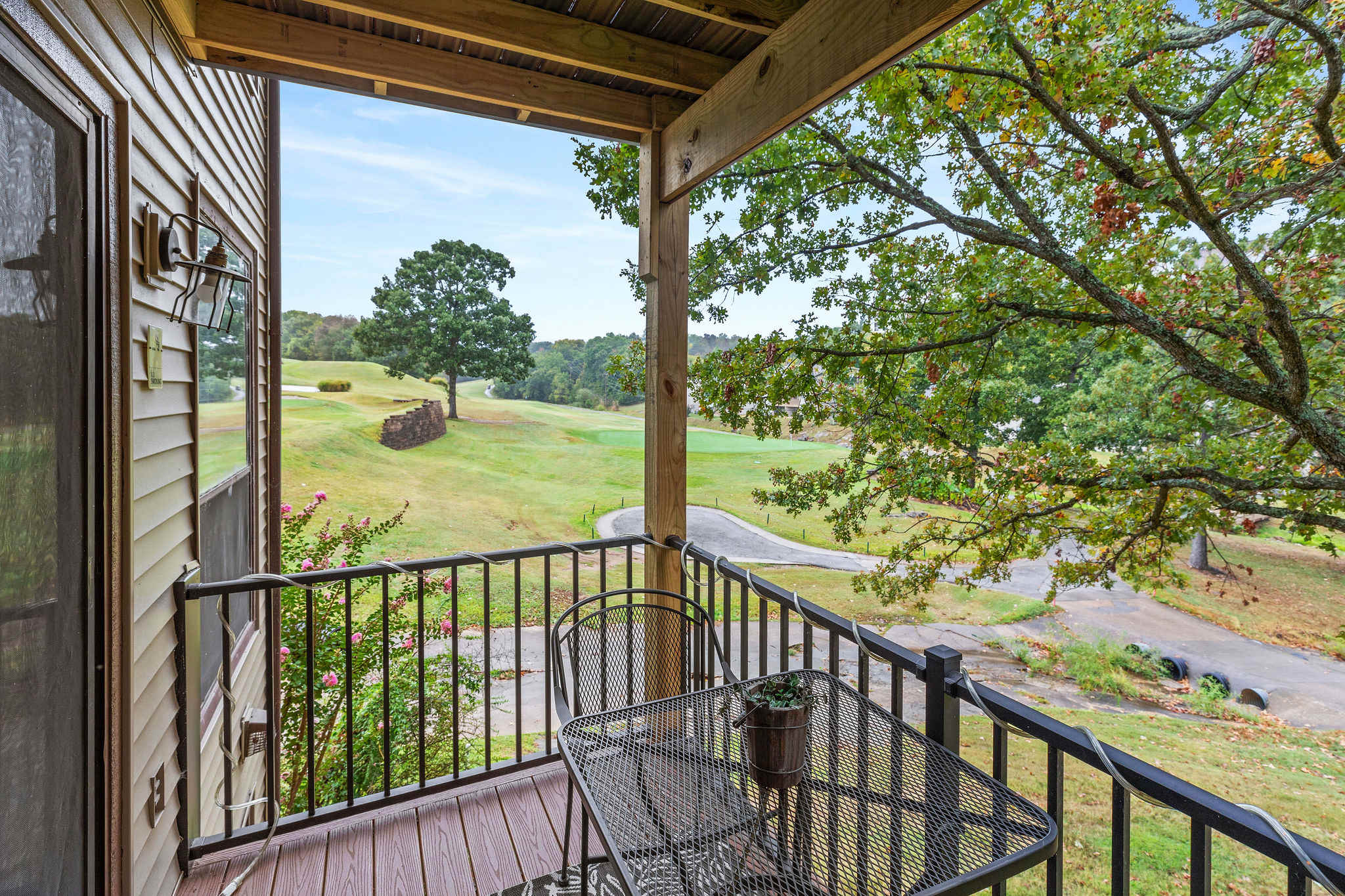 Balcony seating. This condo is located on the second floor, which boasts a gorgeous view overlooking the golf course. There are approximately 10 steps.