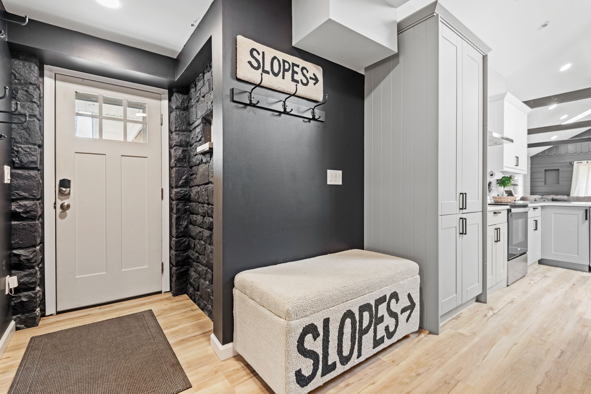 Warm & Inviting Entryway
Step into a beautifully designed entryway that welcomes you with cozy textures, stylish décor, and a touch of rustic charm. The perfect start to your mountain getaway!