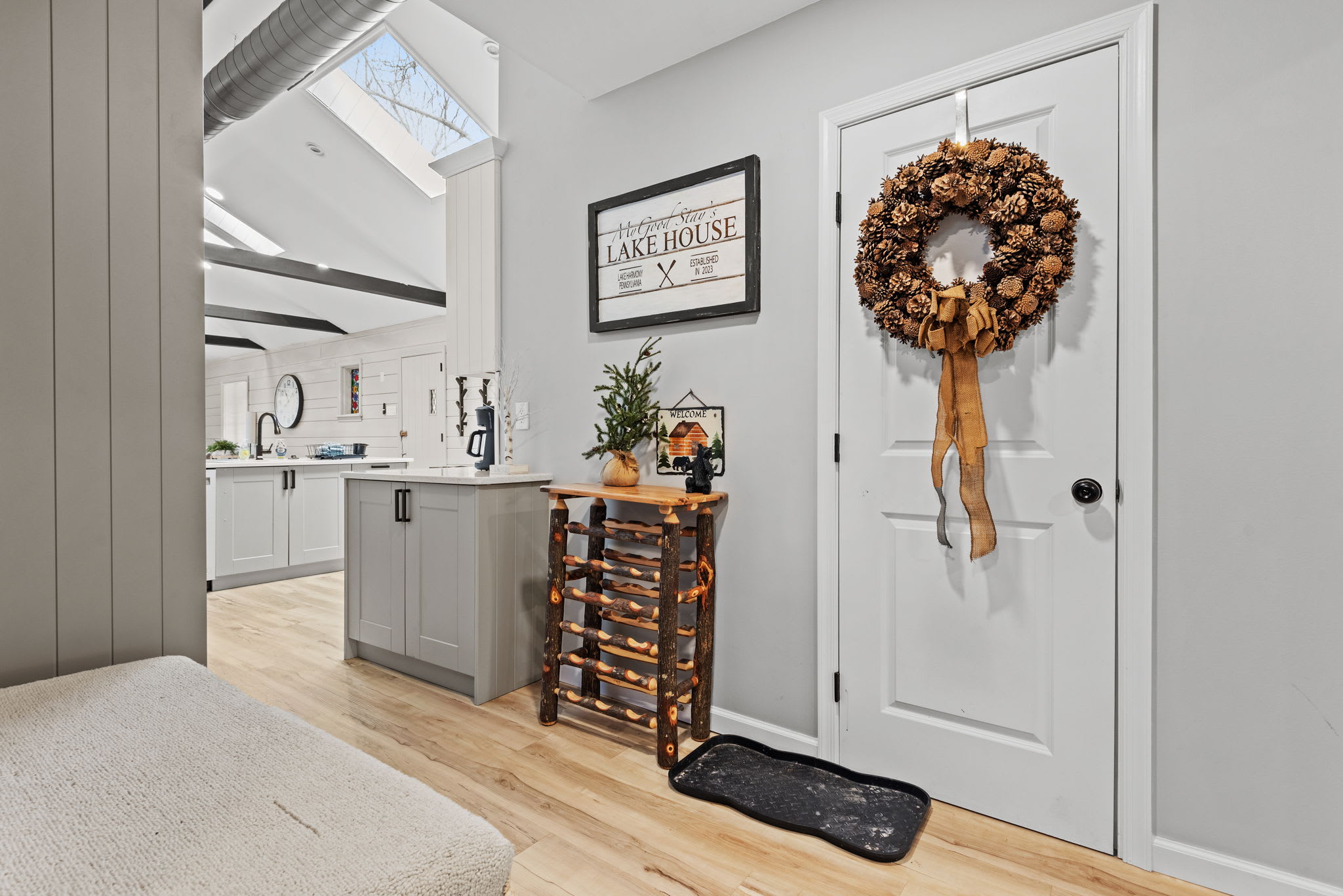 A bright and organized entryway featuring a cozy bench and stylish accents, ensuring every arrival and departure is effortless and inviting.