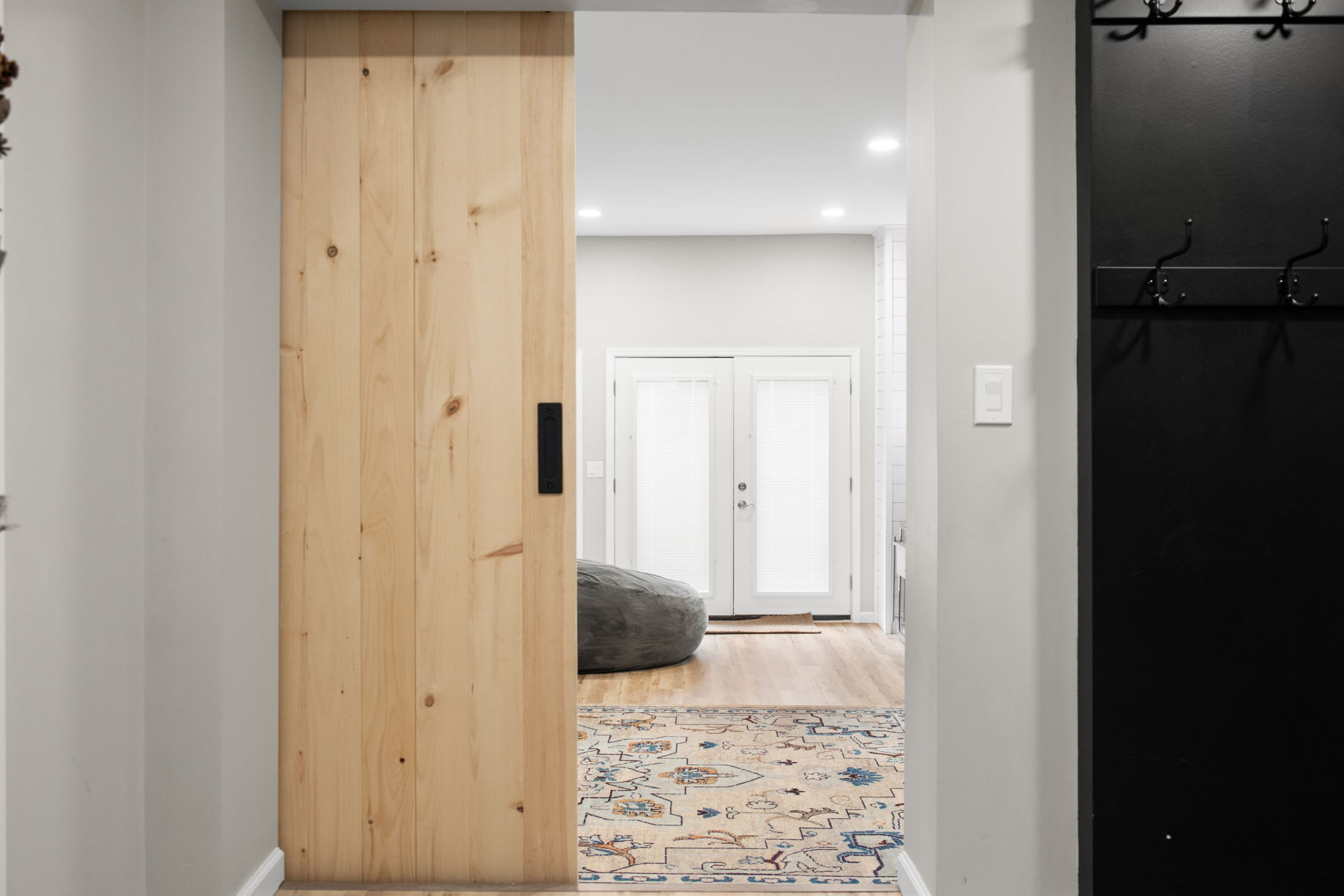 Seamless Flow into the Heart of the Home
This beautifully designed hallway connects you to the cozy living spaces, inviting you further into a retreat where relaxation and adventure go hand in hand.