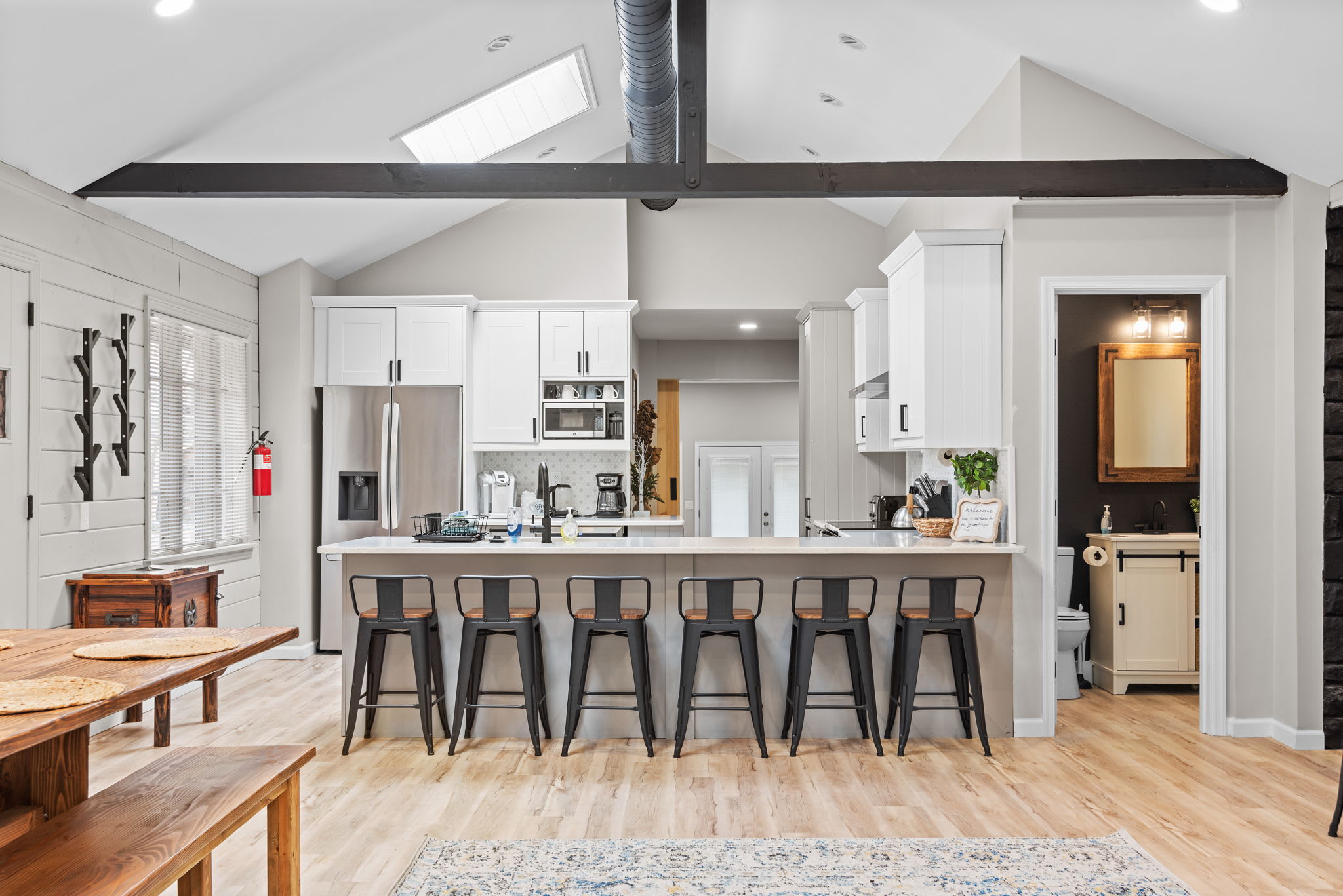 Stylish Kitchen with a Statement Island
A chef’s delight! This beautifully designed kitchen features a large island with sleek barstools, vaulted ceilings with exposed beams, and an open-concept flow that makes cooking and socializing a breeze.