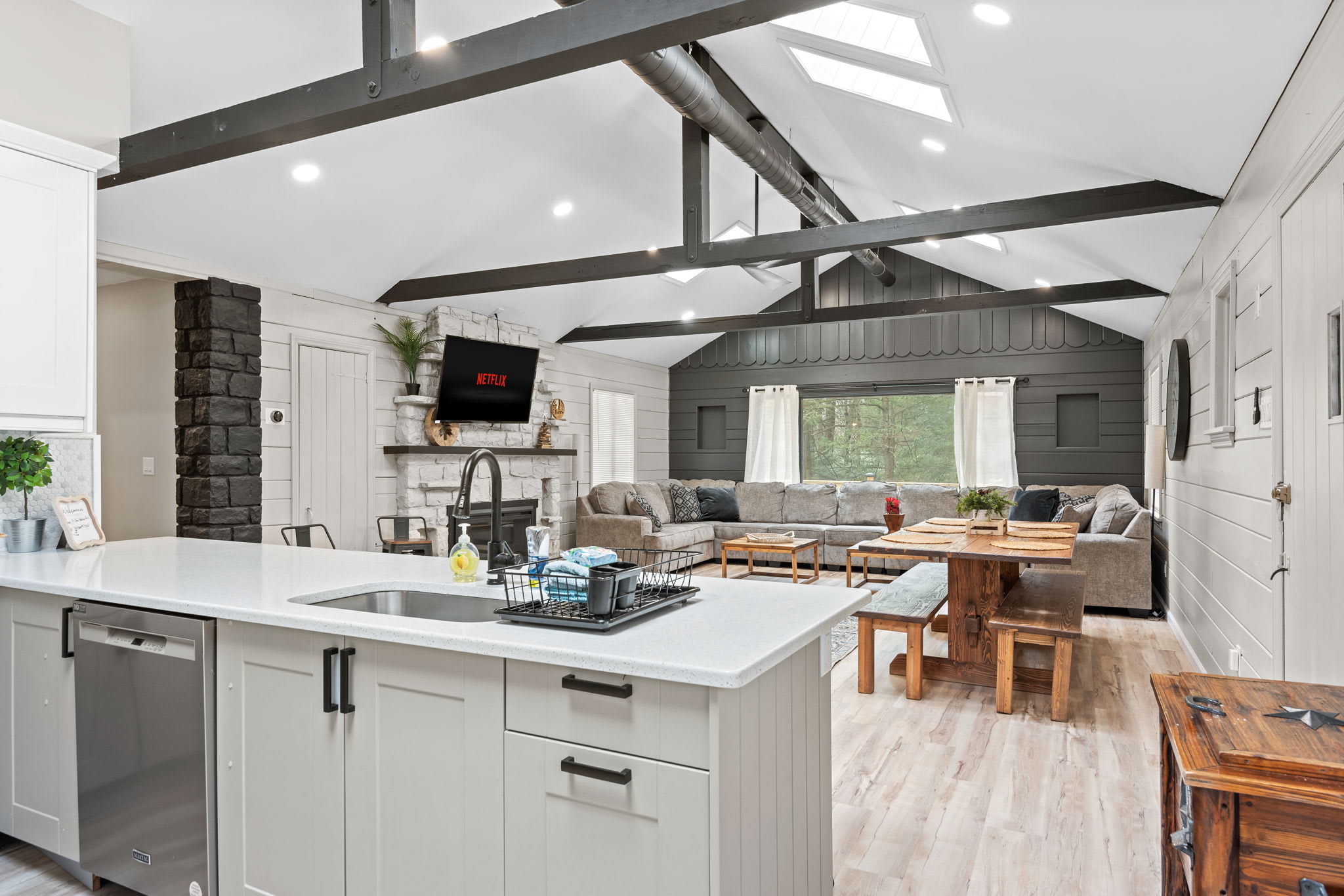Airy & Bright Kitchen Design
High vaulted ceilings, exposed beams, and natural light flooding through large windows make this kitchen feel spacious and welcoming, ideal for cooking and gathering.