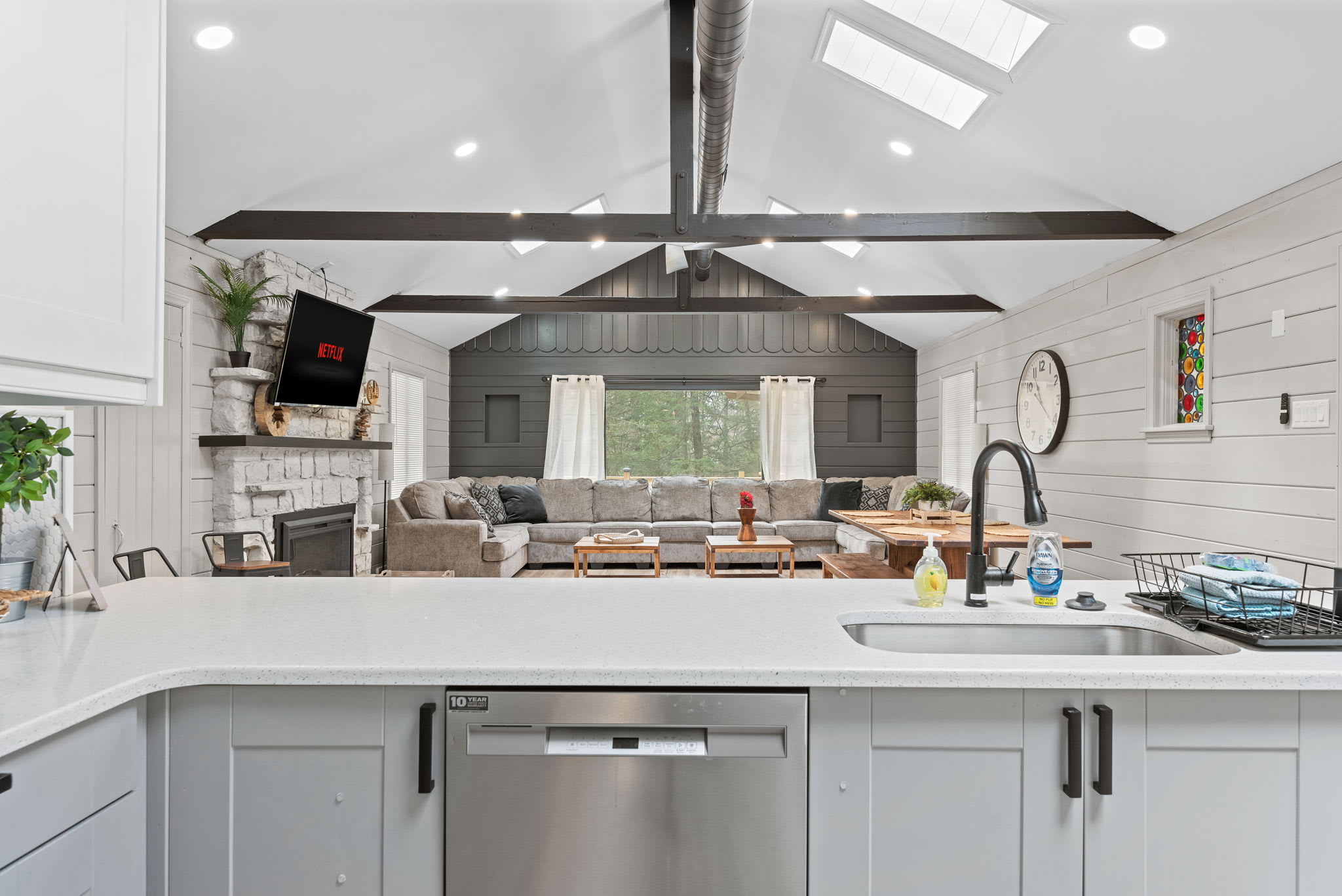 Expansive Kitchen with Open Views
This beautifully designed kitchen offers a perfect blend of style and function. With sleek gray cabinetry, a spacious island, and a seamless flow into the living area, it’s a chef’s dream!