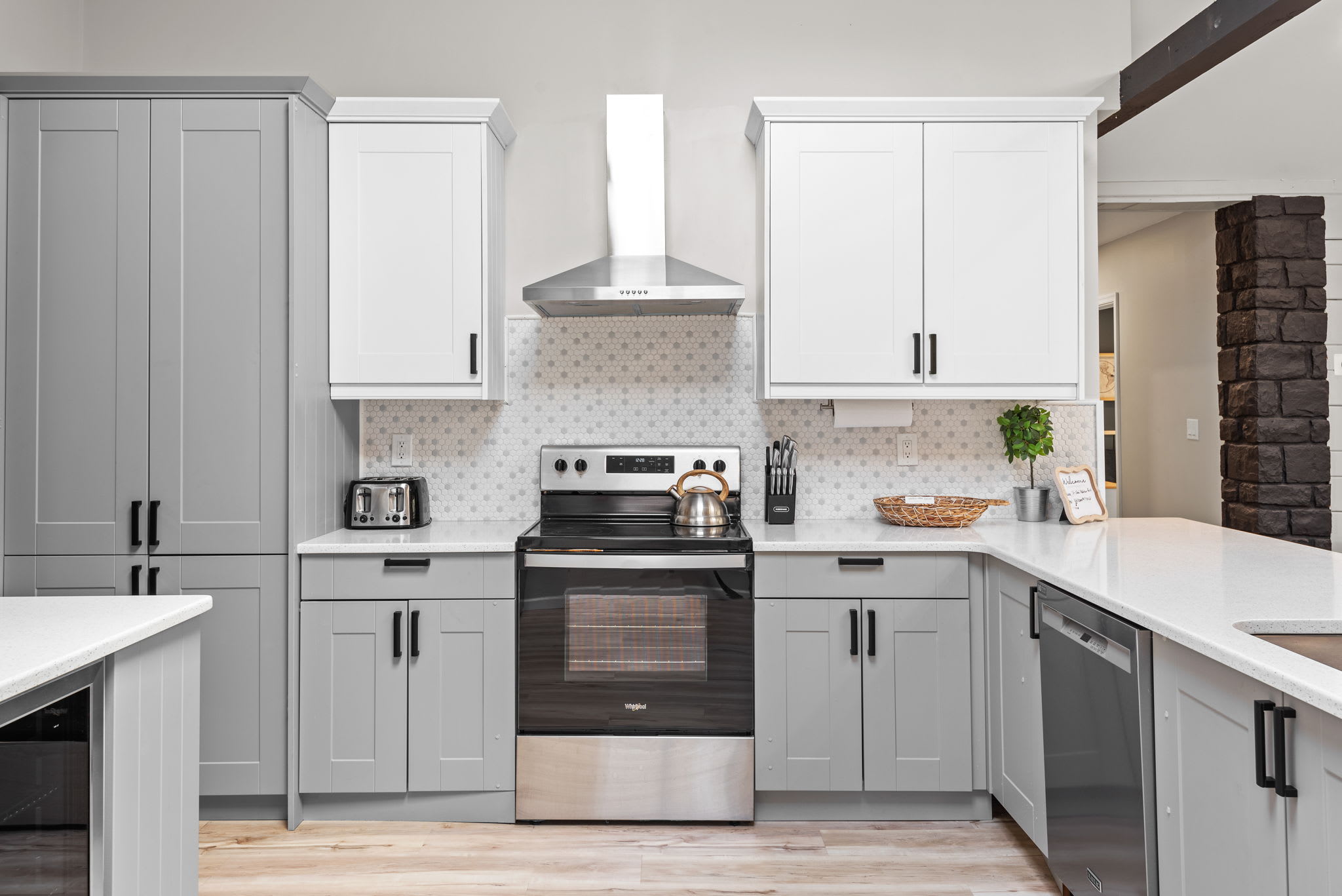 Sleek & Modern Cooking Space
A stunning blend of white and gray cabinetry, modern backsplash, and stainless steel appliances create a stylish and fully equipped kitchen ready for all your culinary adventures.