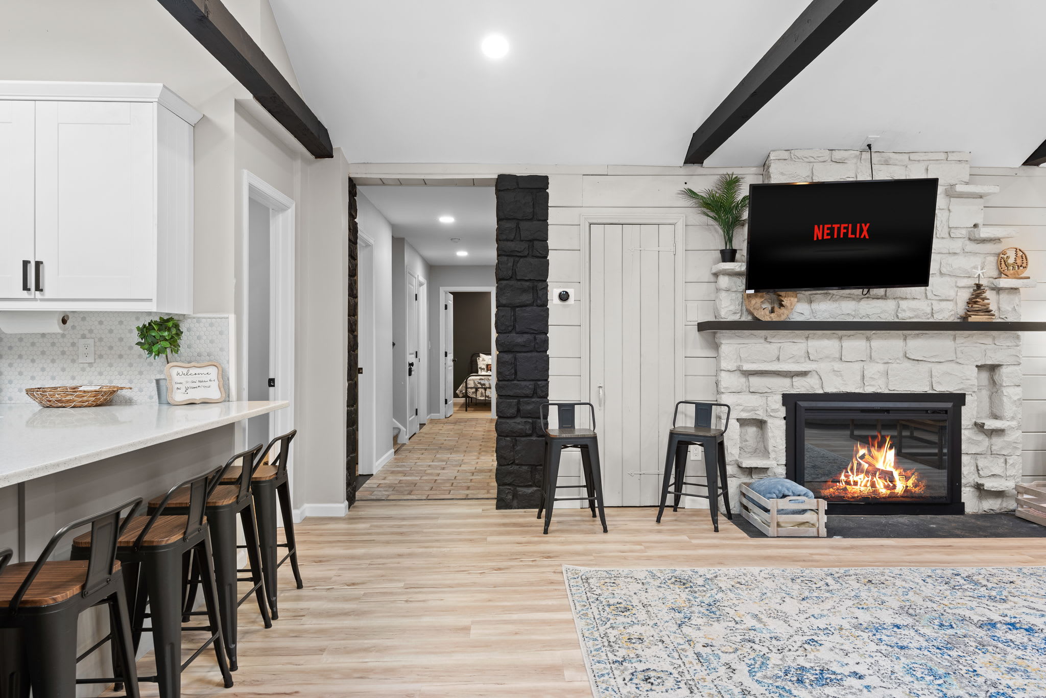 Seamless Open Concept Living
A warm and stylish flow from the kitchen to the living area, featuring high ceilings, a cozy fireplace, and a breakfast bar that makes every gathering feel special.