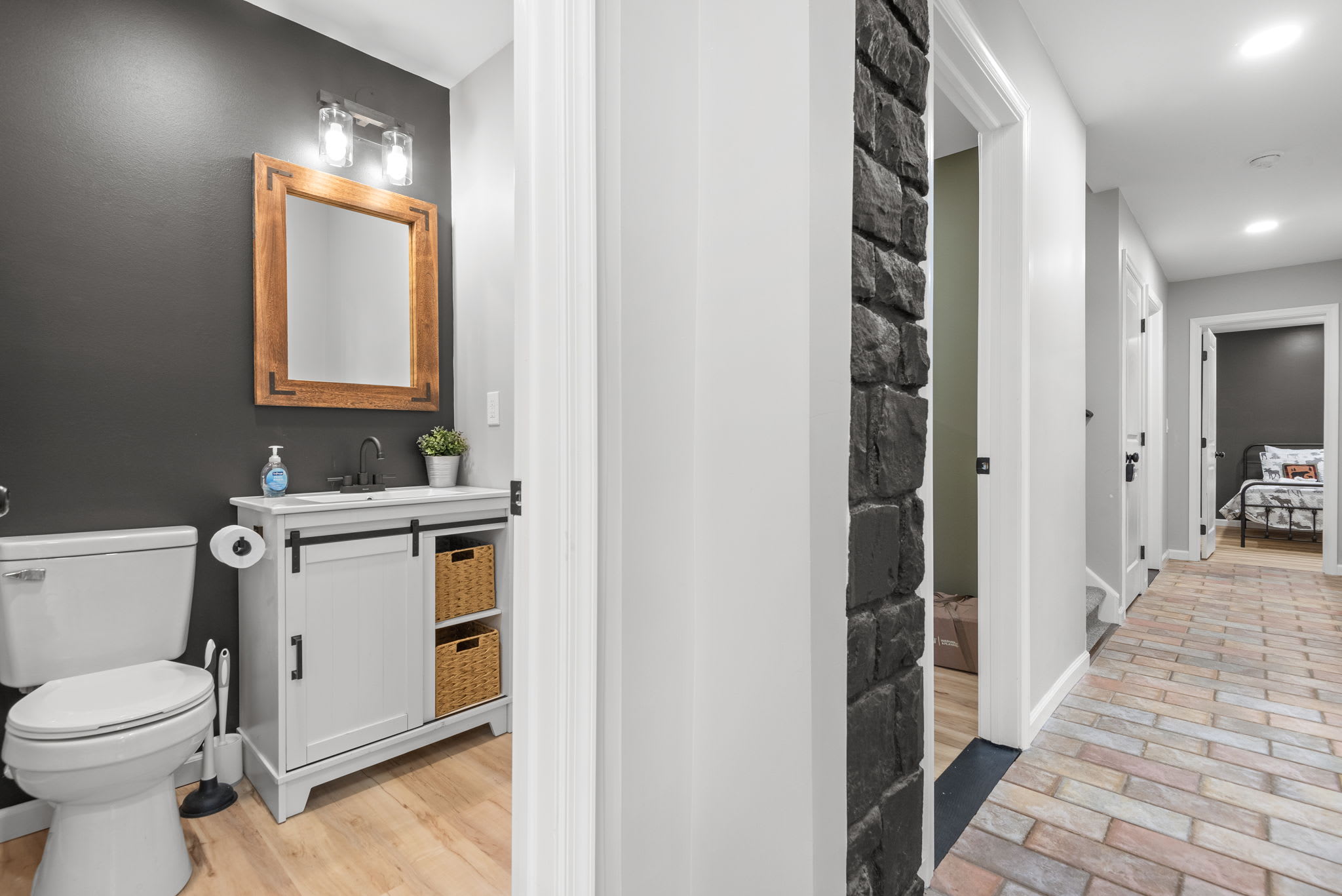 Sleek & Stylish Bathroom Retreat
A modern yet rustic bathroom with a chic vanity, warm wooden accents, and a soft neutral color palette offering a relaxing space to refresh and unwind.