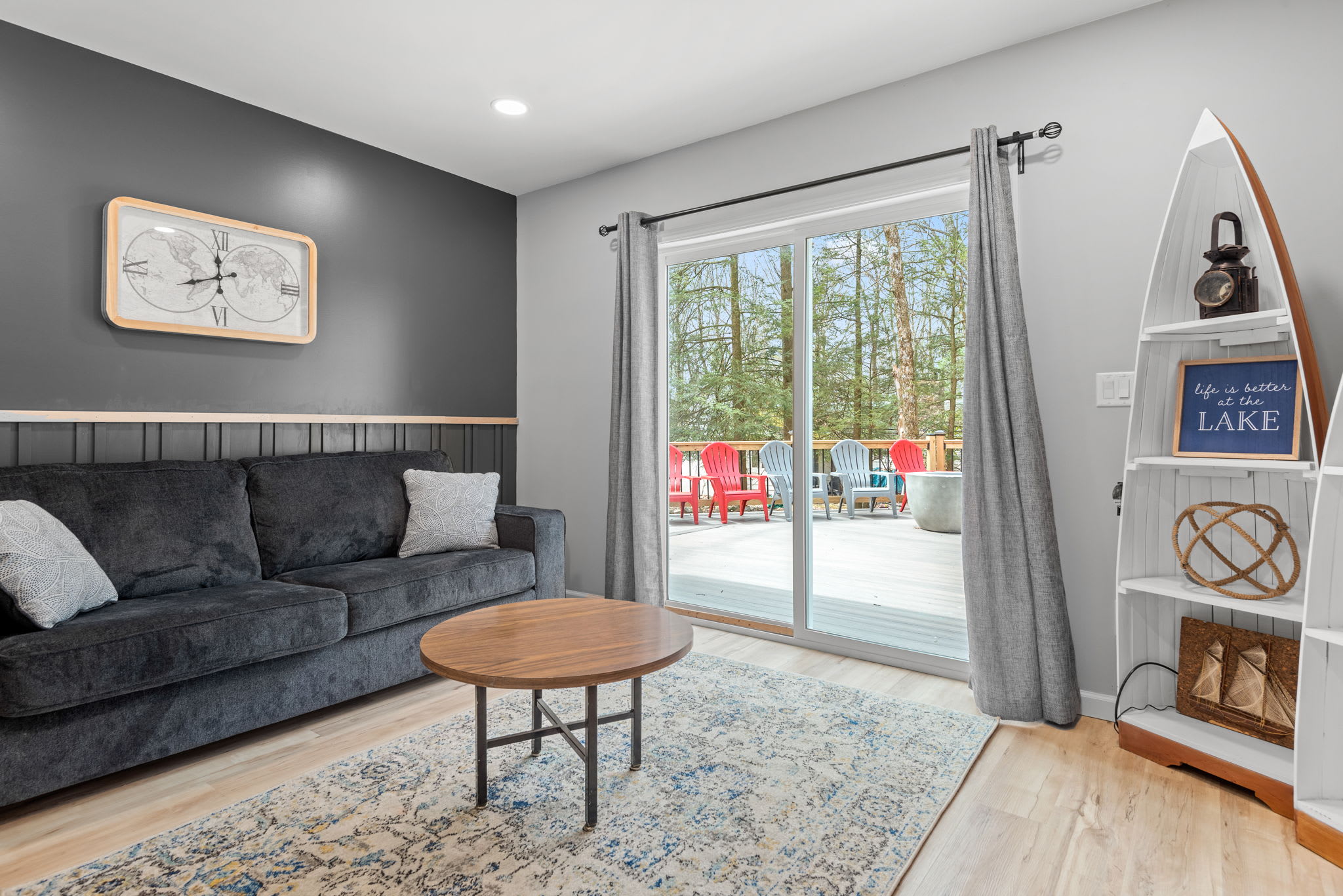 A Stylish & Versatile Space
A unique bedroom featuring a cozy seating area, modern decor, and large sliding doors leading to the outdoor deck, bringing in plenty of natural light and fresh air.