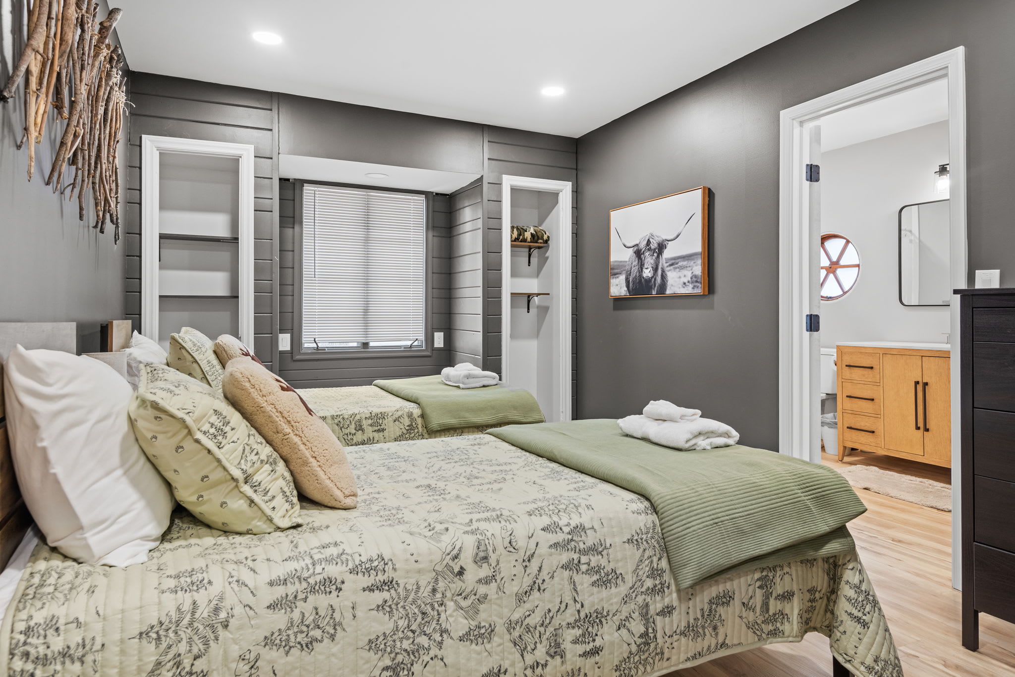 A Cozy Cabin-Inspired Retreat
A warm and inviting bedroom with a rustic touch! Featuring soft green bedding, woodsy decor, and modern comforts, this space is perfect for a restful night's sleep.