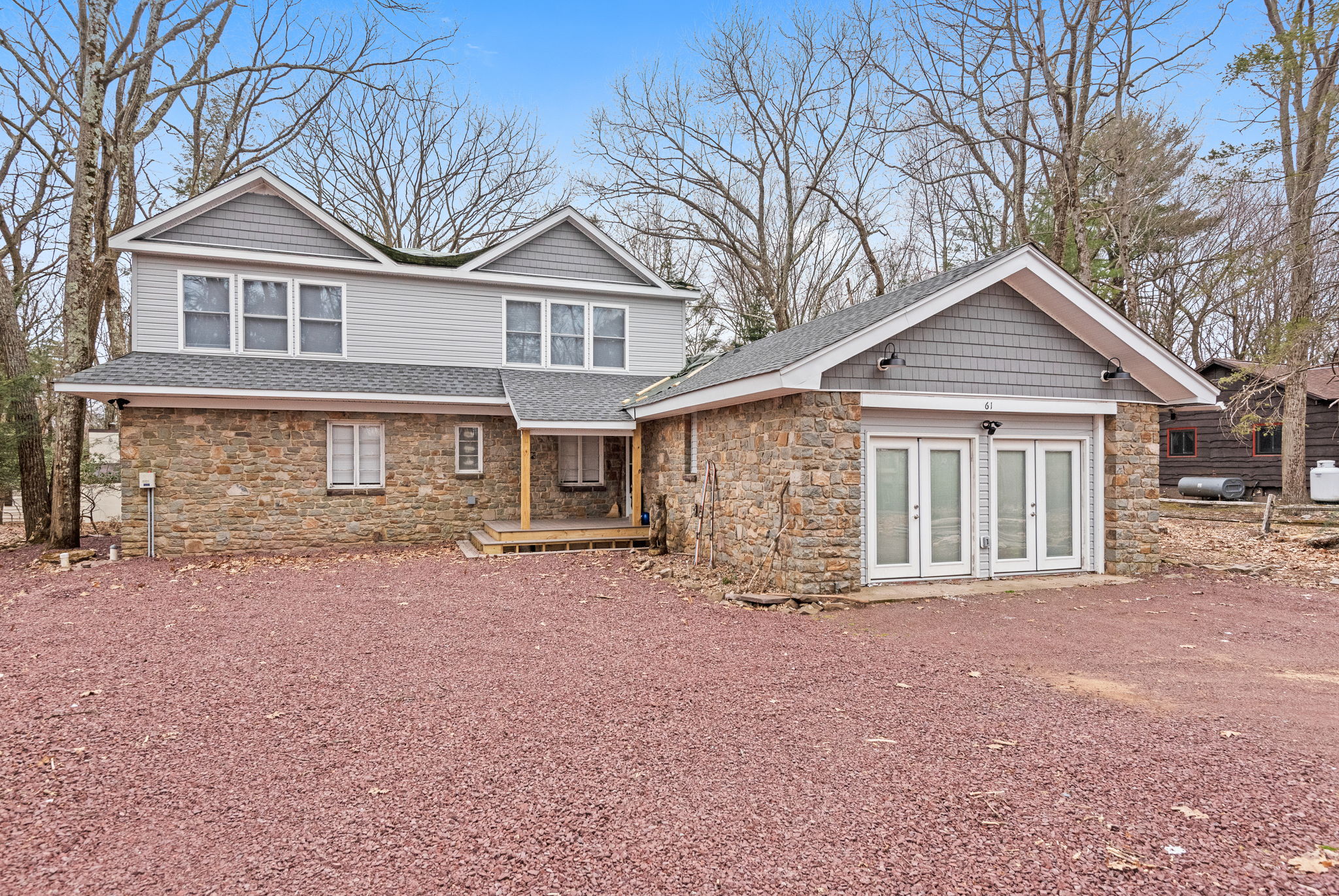 Stunning Lodge-Style Architecture
A beautifully designed home with a mix of rustic charm and modern upgrades, featuring large windows, elegant French doors, and timeless stone accents.