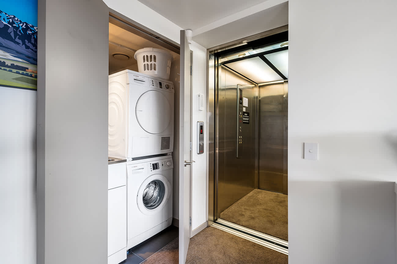 Convenient Laundry Room with Modern Appliances
This fully equipped laundry room features modern appliances, including a washing machine and dryer, making it easy to refresh your linens and clothes during your stay.