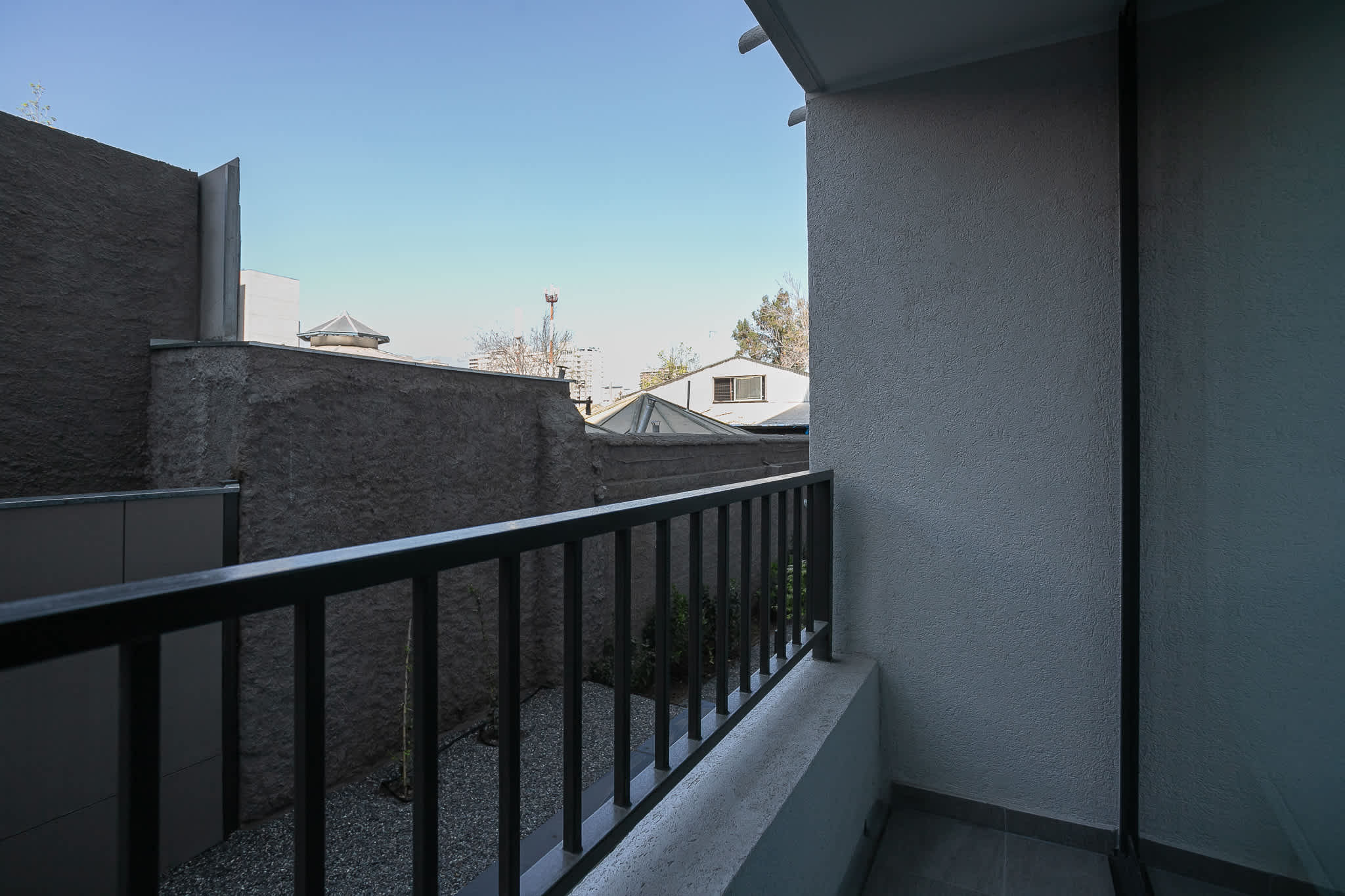 Enjoy a breath of fresh air on your private balcony with urban views, perfect for a morning coffee or evening relaxation.