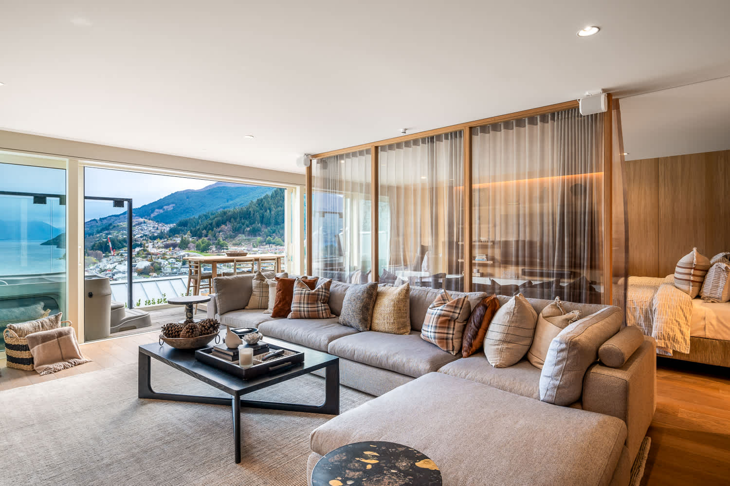 Spacious Second Living Room with Stunning Lake Views
Relax in this second living room, where large windows frame breathtaking views of Lake Wakatipu. The inviting space offers the perfect blend of comfort and style.