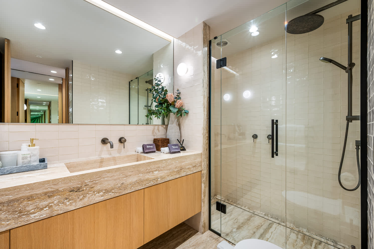 Stylish Ensuite Bathroom with Modern Amenities
Discover the elegance of this ensuite bathroom, featuring a spacious layout with a luxurious walk-in shower and contemporary fixtures. Complete with premium bath products.