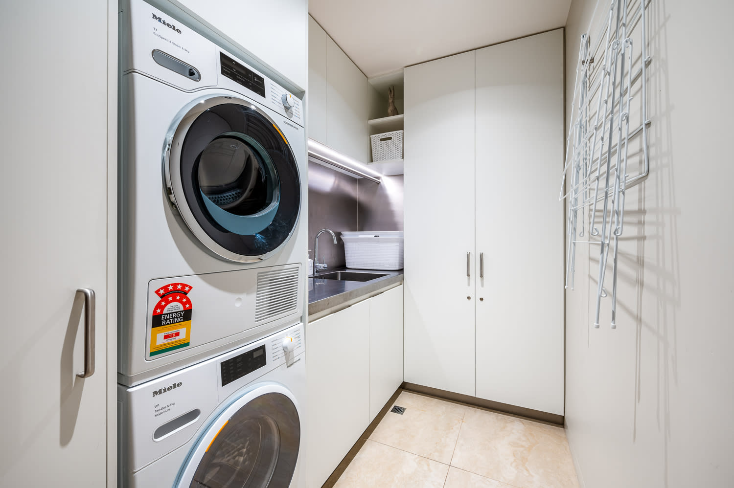 Convenient Laundry Room with Modern Appliances
This fully equipped laundry room features modern appliances, including a washing machine and dryer, making it easy to refresh your linens and clothes during your stay.