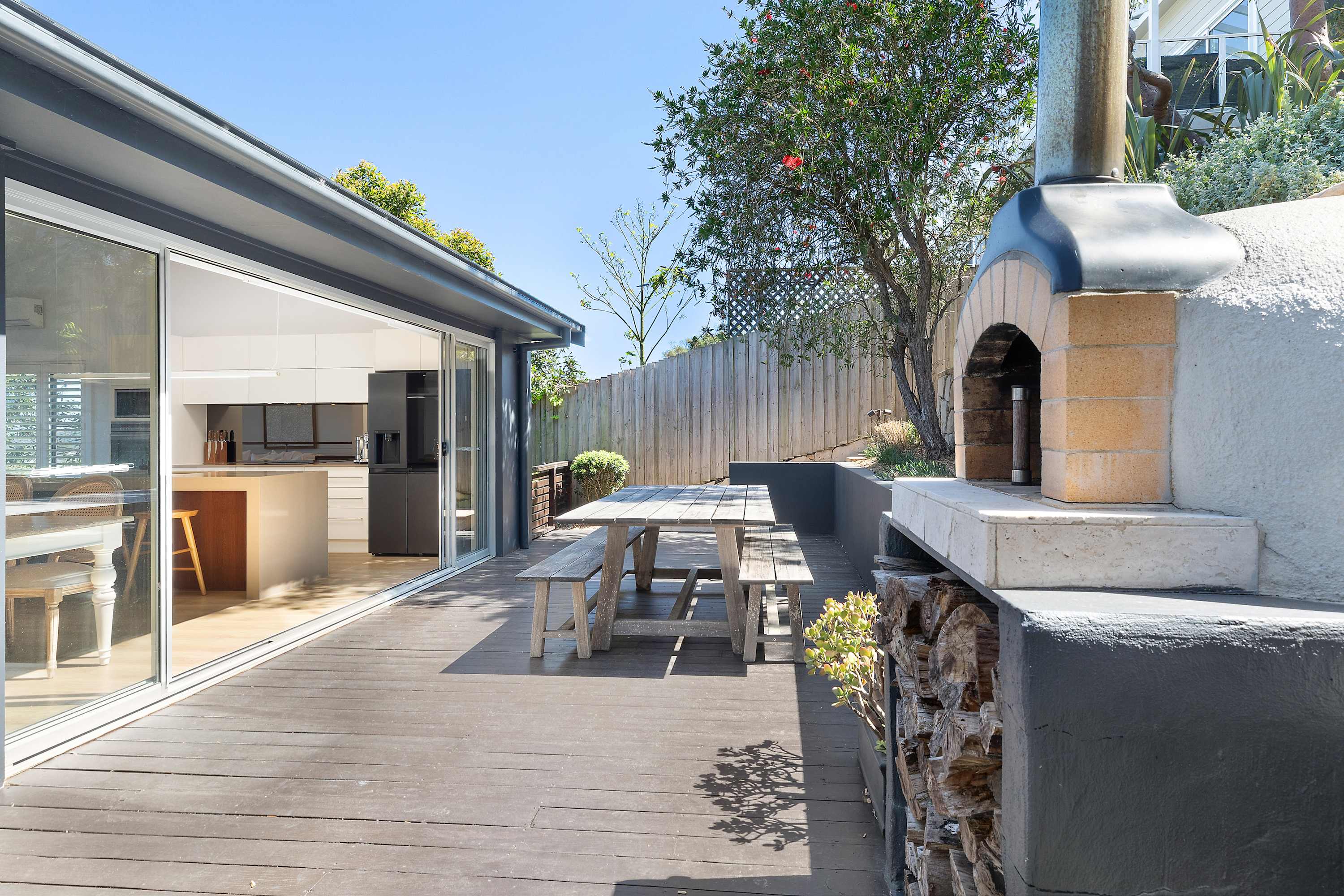 One hundred and eighty degrees of Pacific Ocean. Whales in season. The Sydney skyline at night. Welcome to The Vista. The Vista is a design-forward coastal home perched on a quiet Copacabana ridgeline — sweeping 180-degree ocean views from almost every room, a pizza oven and fire pit in the garden, smart-home integration, and beaches a short drive from the front door. For guests who believe the best holidays begin with a view that stops your mid-step, this is exactly that.