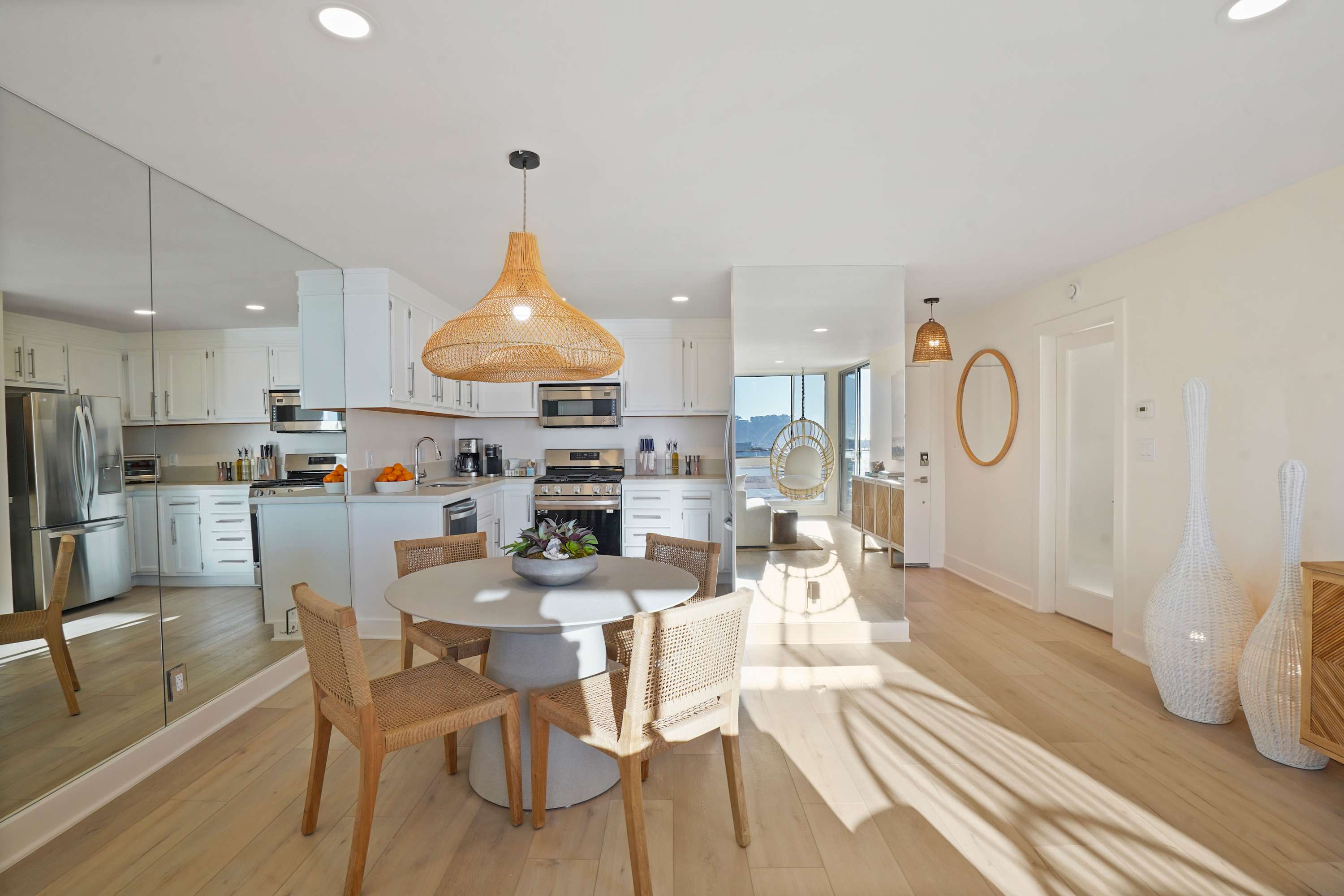 Bright dining area paired with a fully equipped kitchen, ideal for meals with an ocean view.