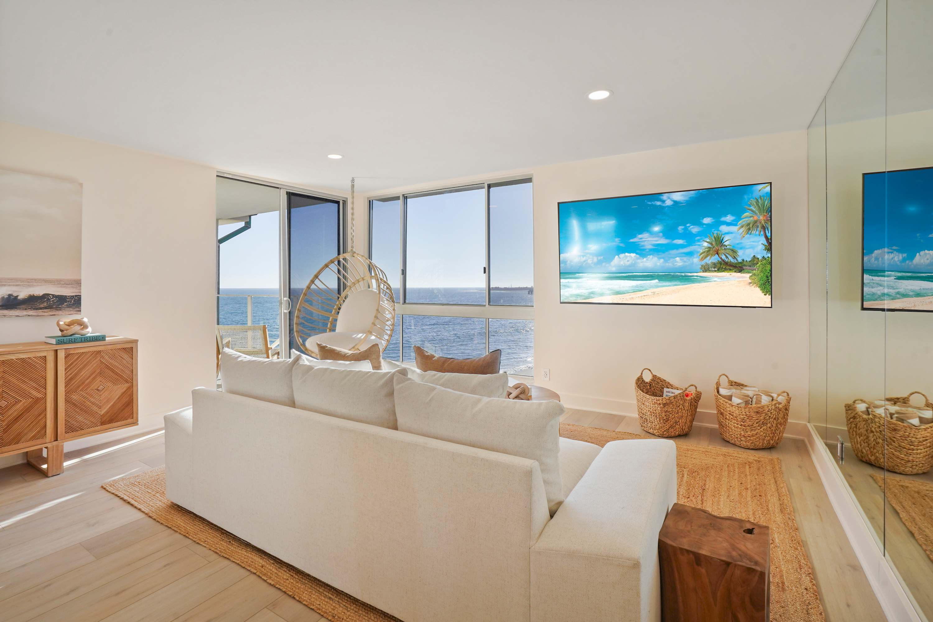 Lounge in comfort while soaking up the ocean view, perfectly framed by floor-to-ceiling windows.