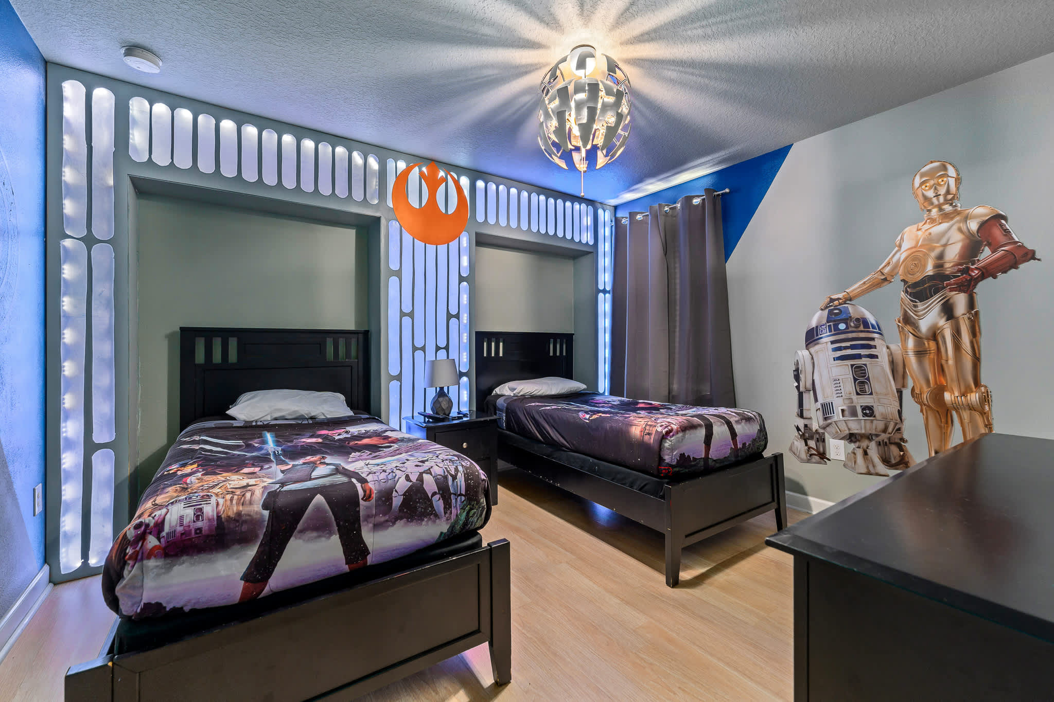 Themed bedroom w/ bold decor and a bed that adds playful character.