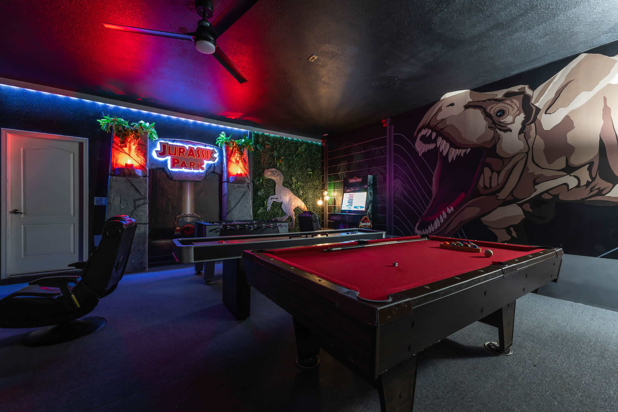Game room w/ pool table and moody lighting for late-night fun.