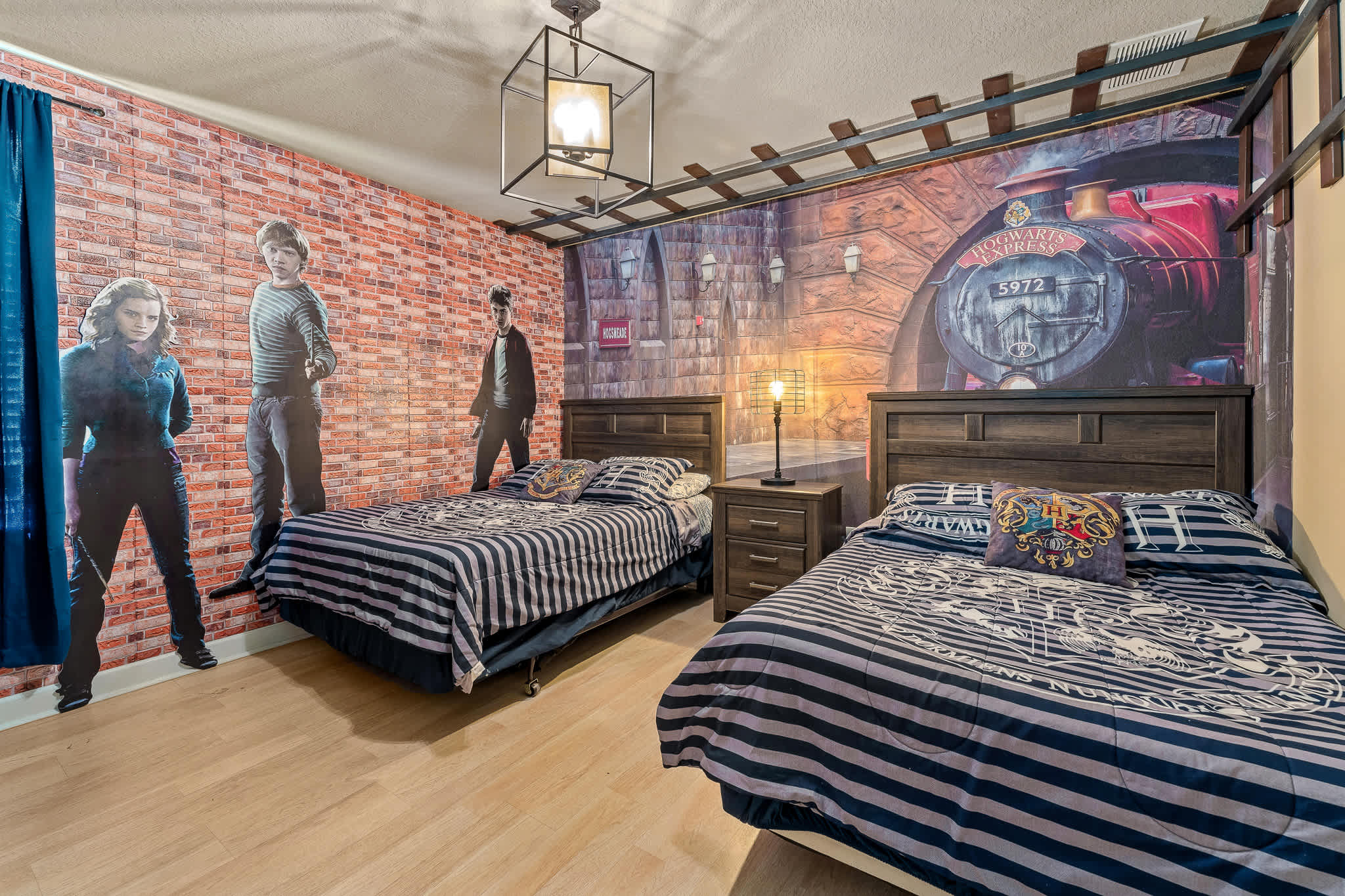 Spacious bedroom w/ bed and accent wall for a relaxed retreat.