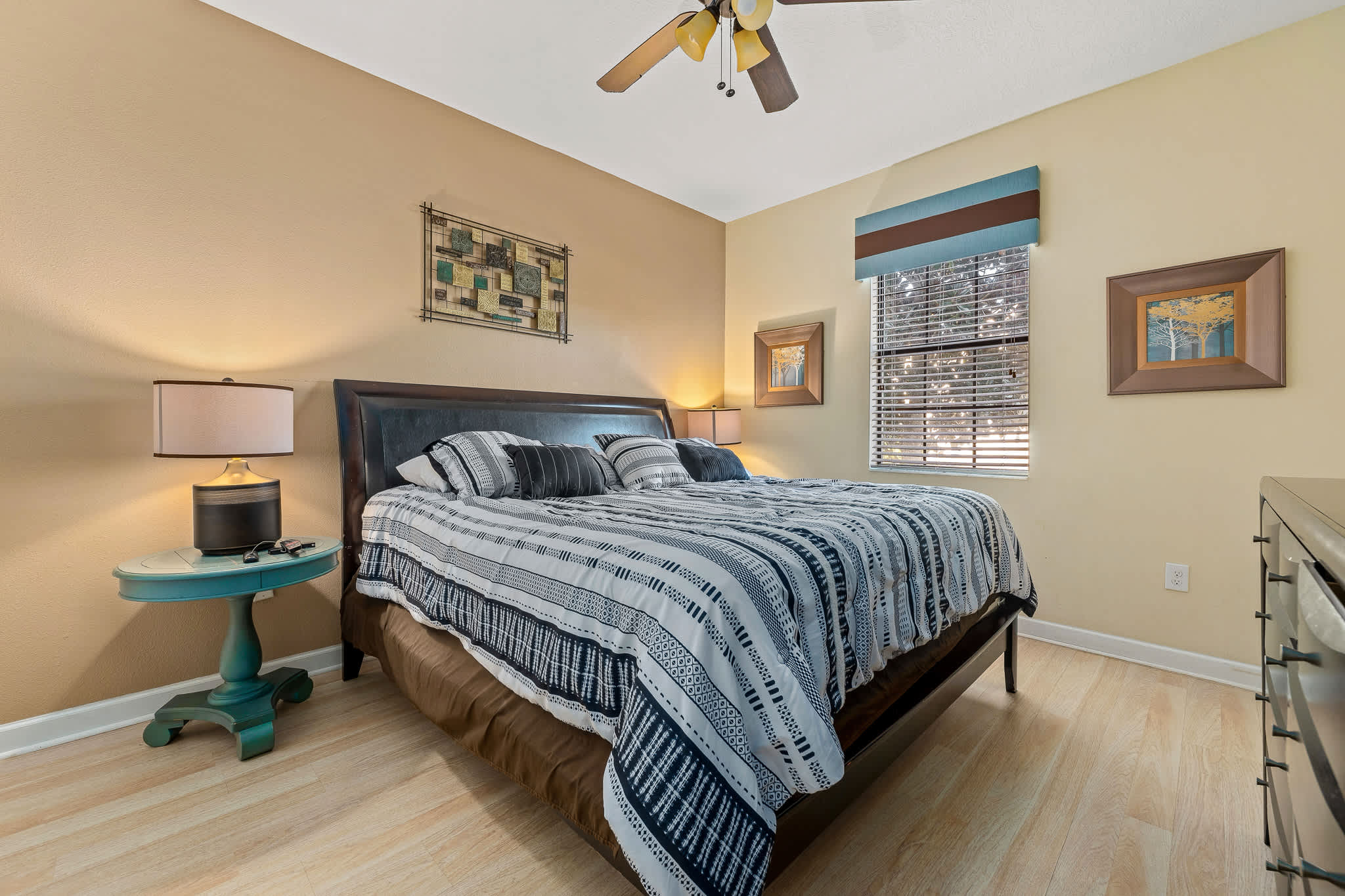 Cozy bedroom w/ bed and warm tones for restful nights.