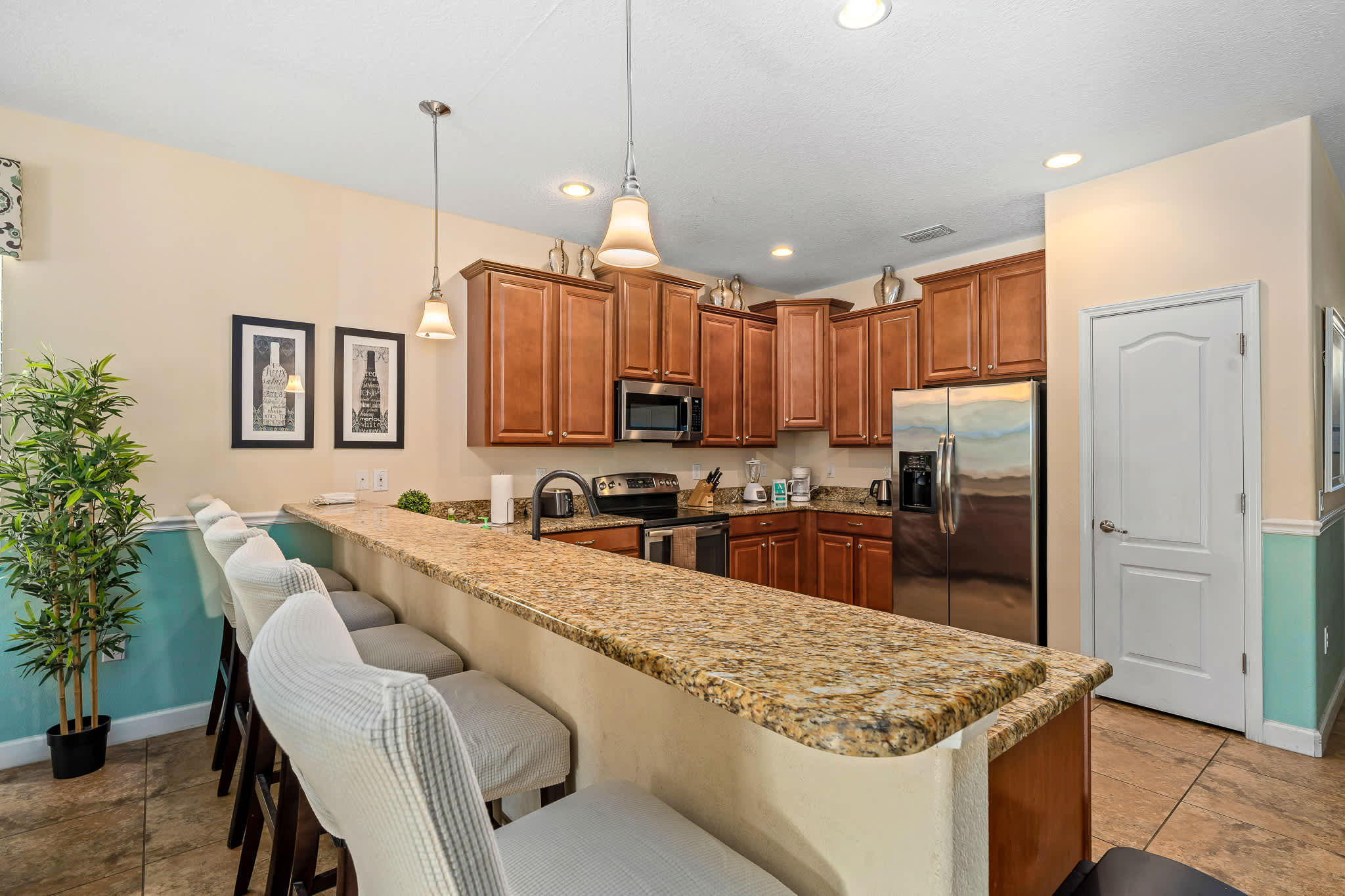 Open kitchen & dining layout designed for casual gatherings.