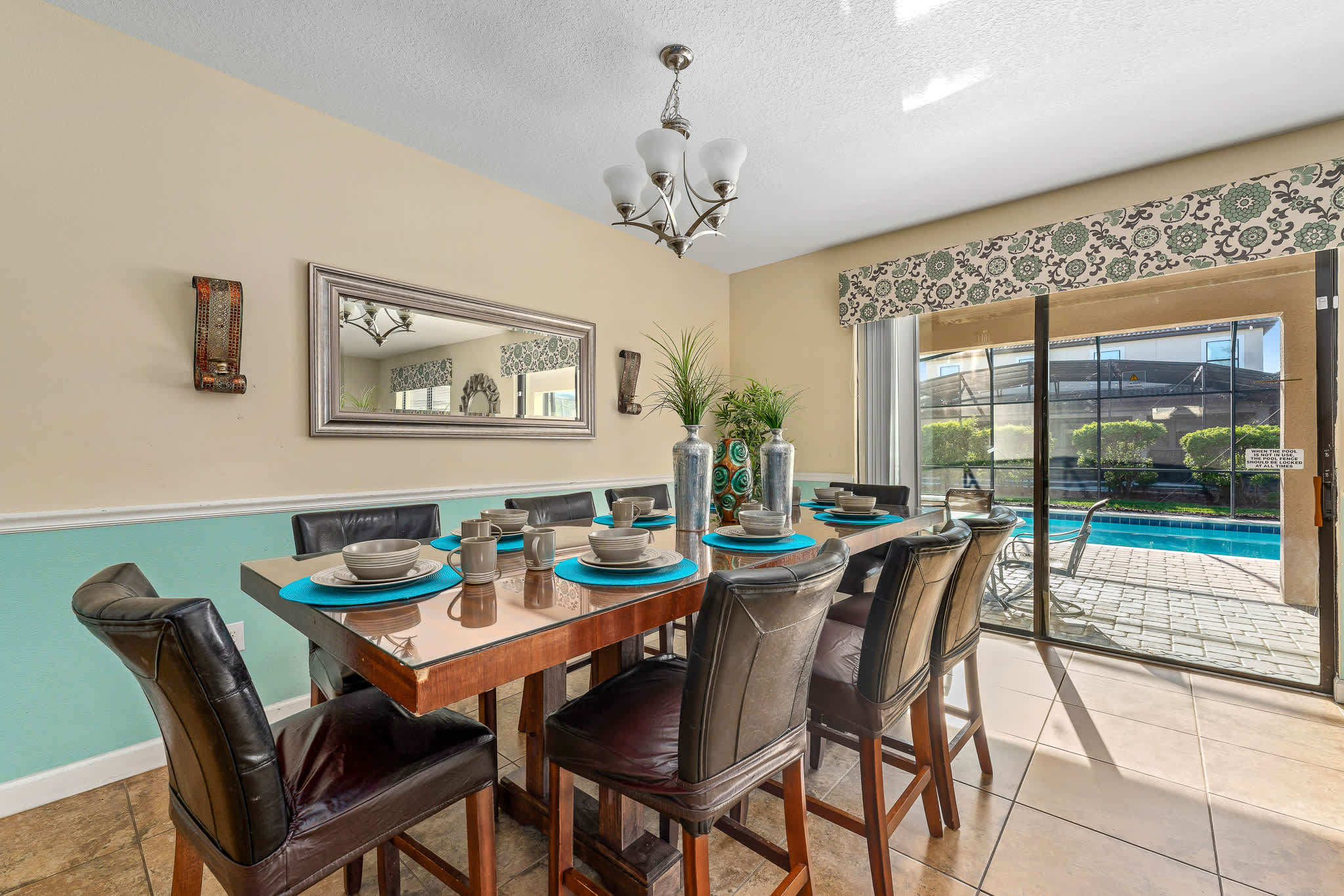 Dining area set by sliding doors, great for shared meals w/ easy indoor-outdoor flow.