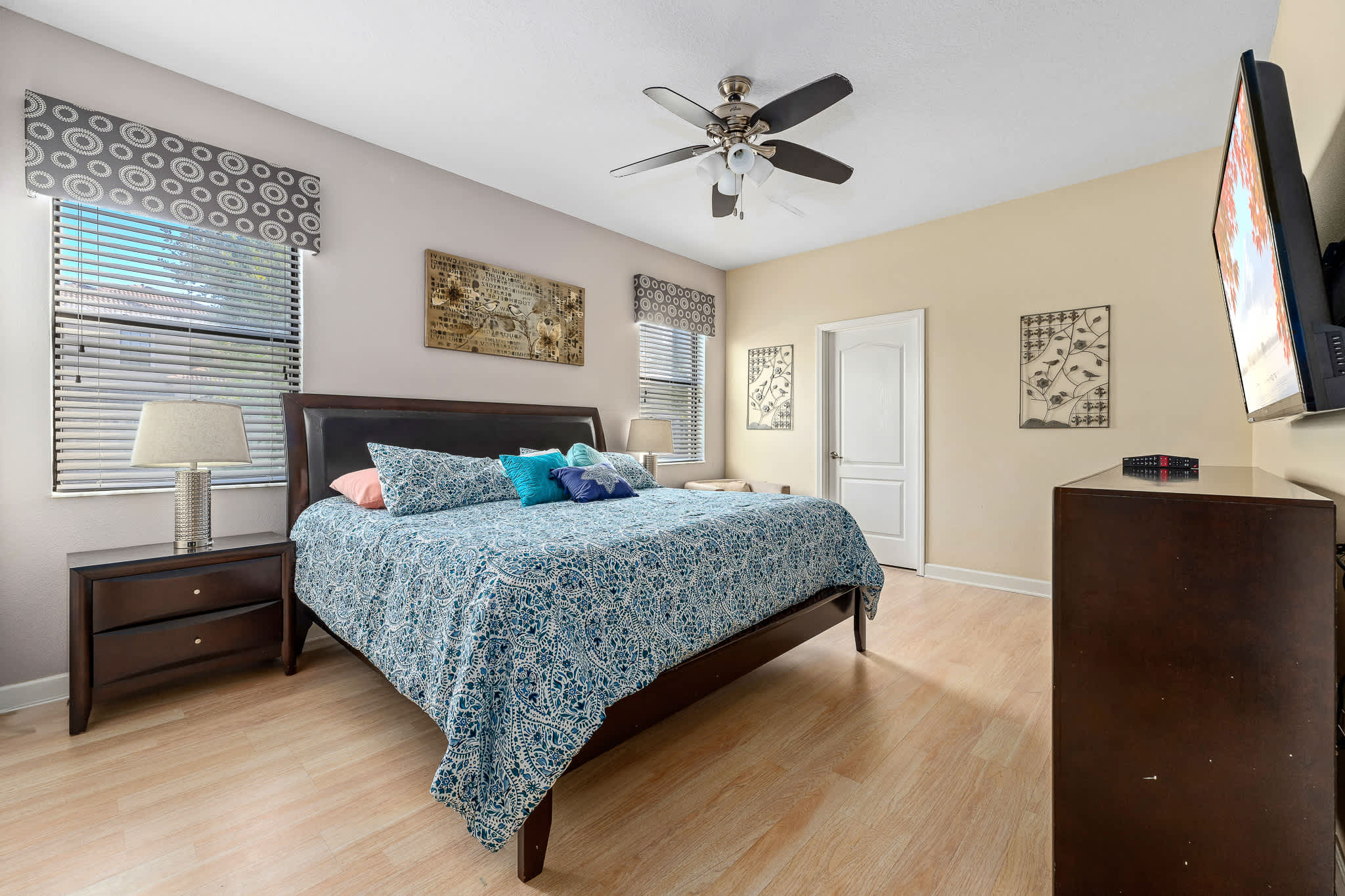 Bedroom w/ bed and soft lighting for a calm, cozy feel.
