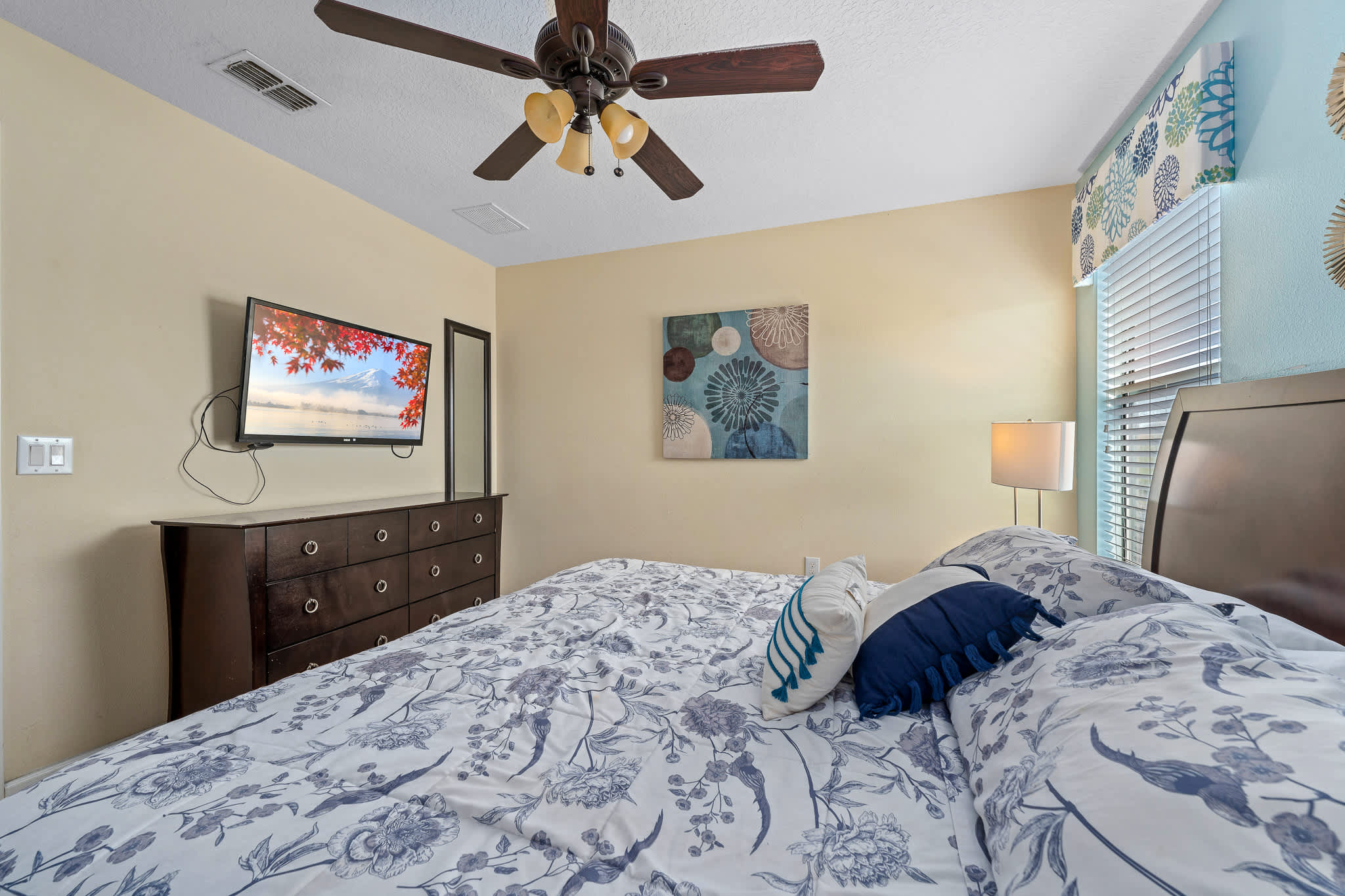 Bedroom w/ bed and TV, great for relaxing after a long day.