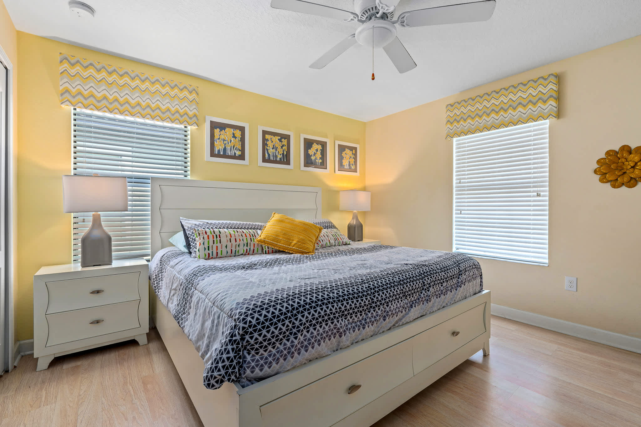 Bedroom w/ bed and accent rug adding a cozy touch.