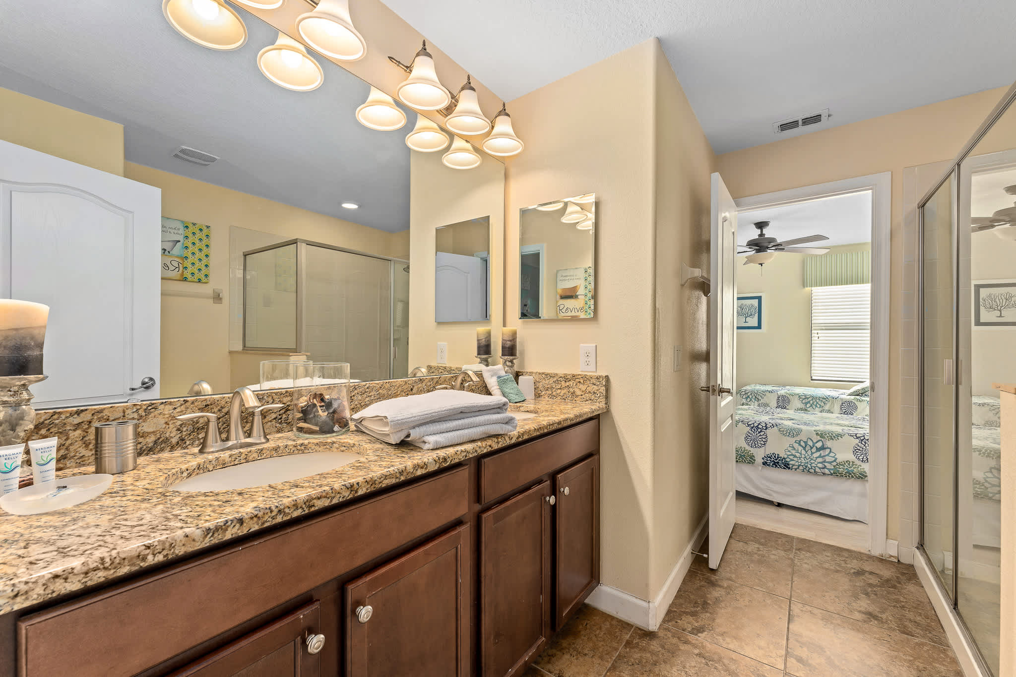 Bathroom vanity w/ sink and ample counter space.