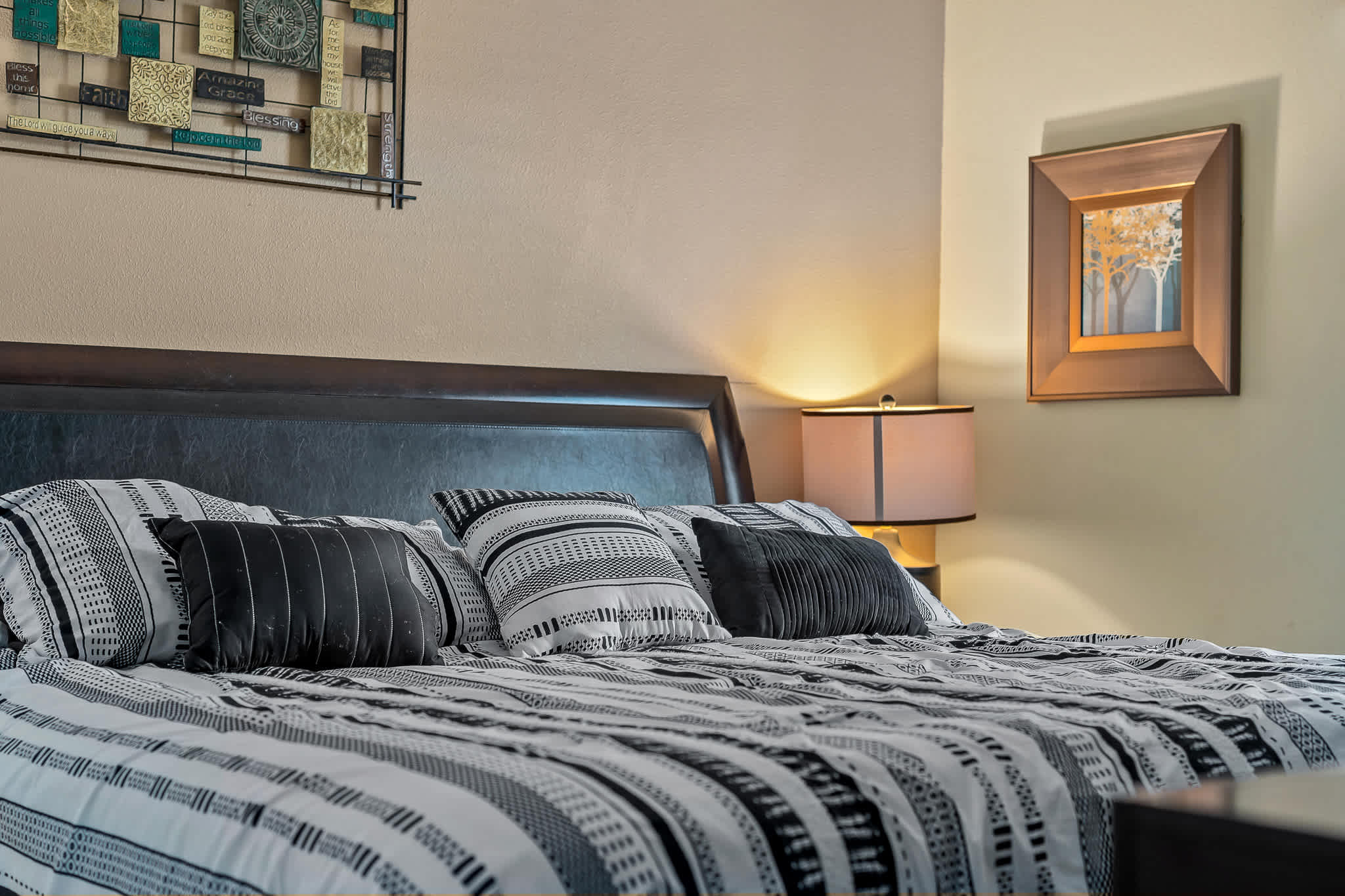 Bedroom w/ bed and plush bedding for cozy sleep.