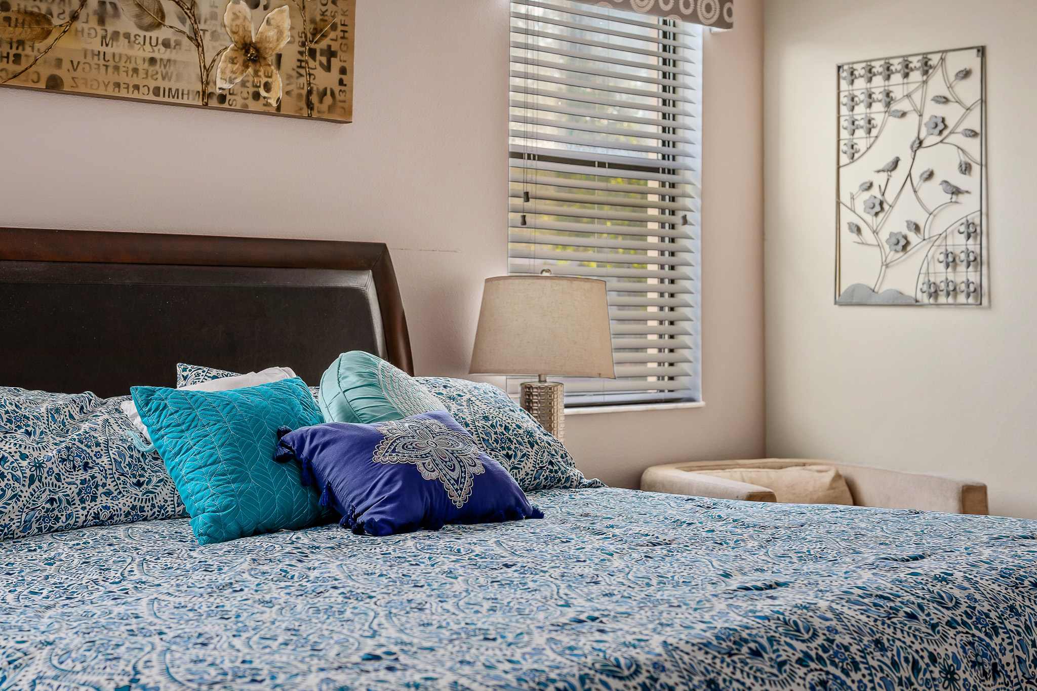 Bedroom w/ bed and plush pillows for cozy rest.