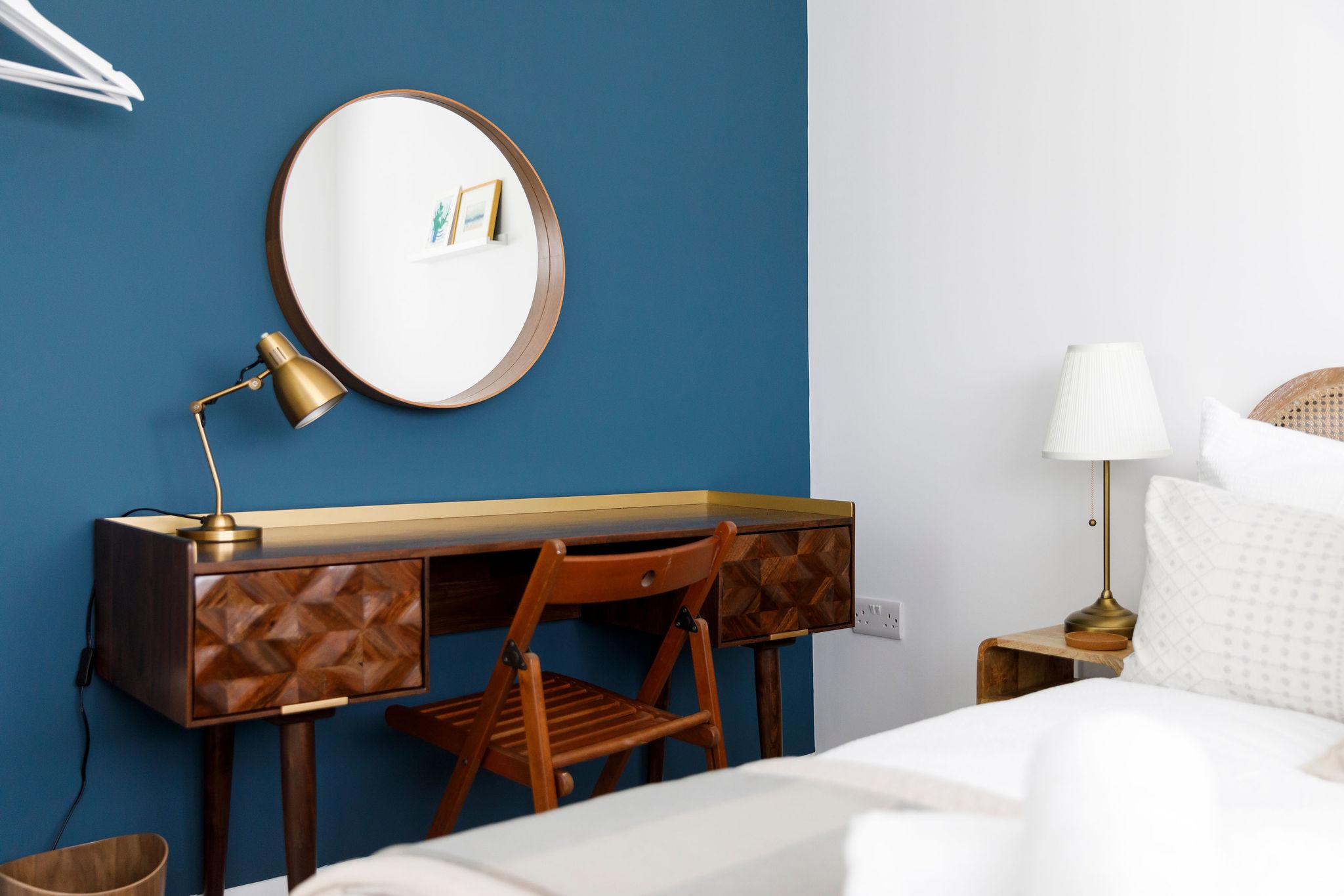 Bedside tables and lamps are in every bedroom.